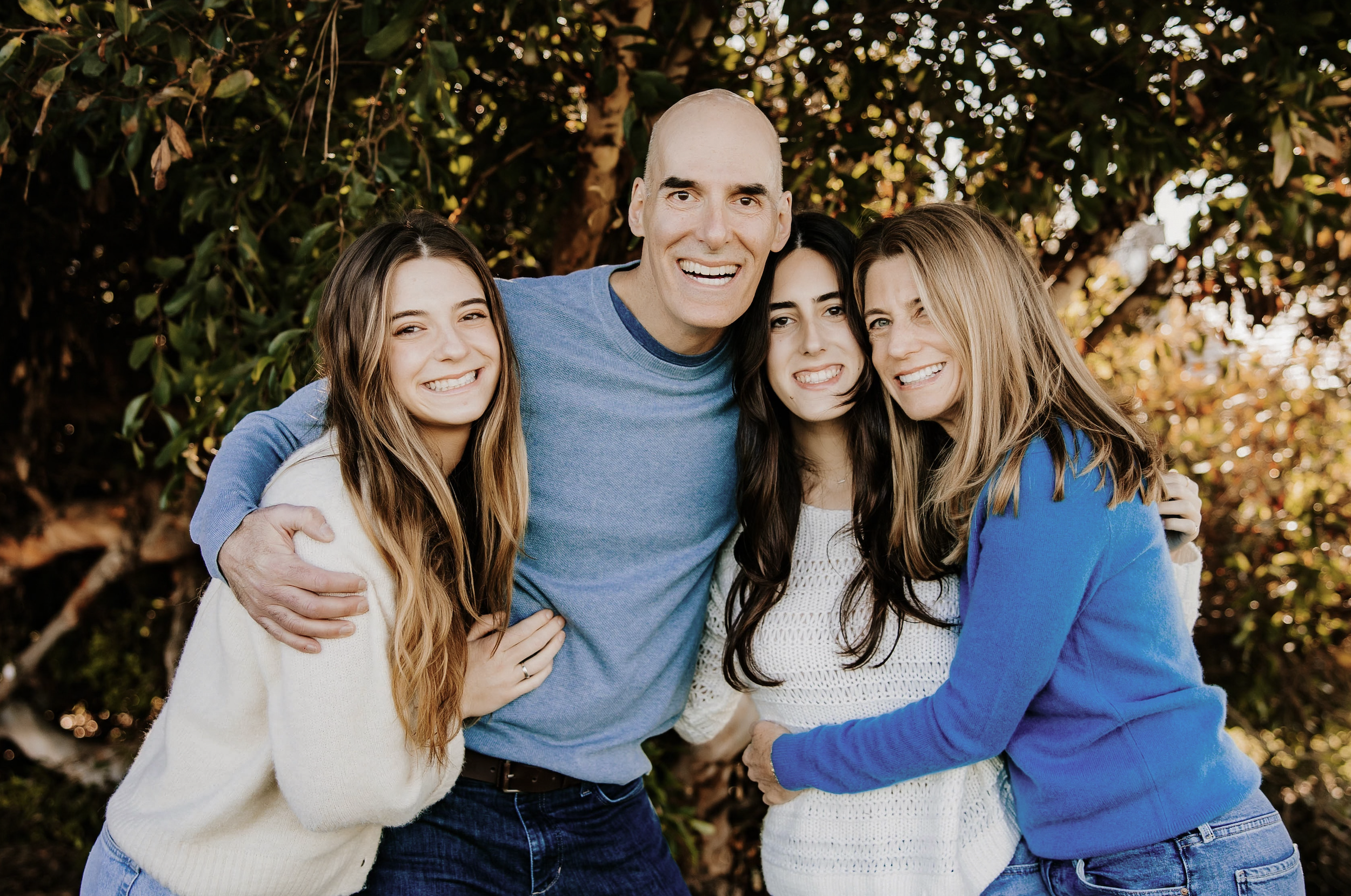 Ilene Schaffer with family outdoors in a natural setting — reflecting her values of connection, warmth, and real-life presence in coaching and life transitions.