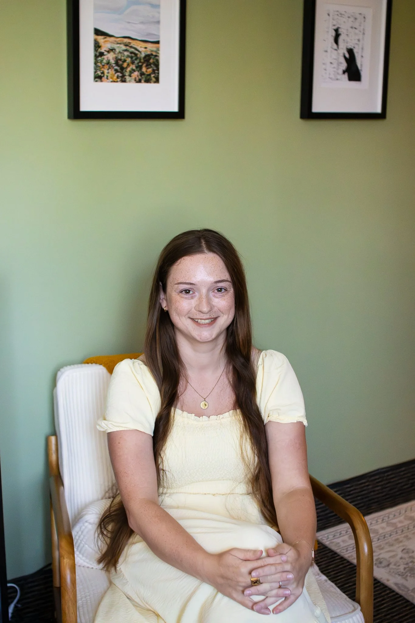 Woman with warm smile and long brown hair