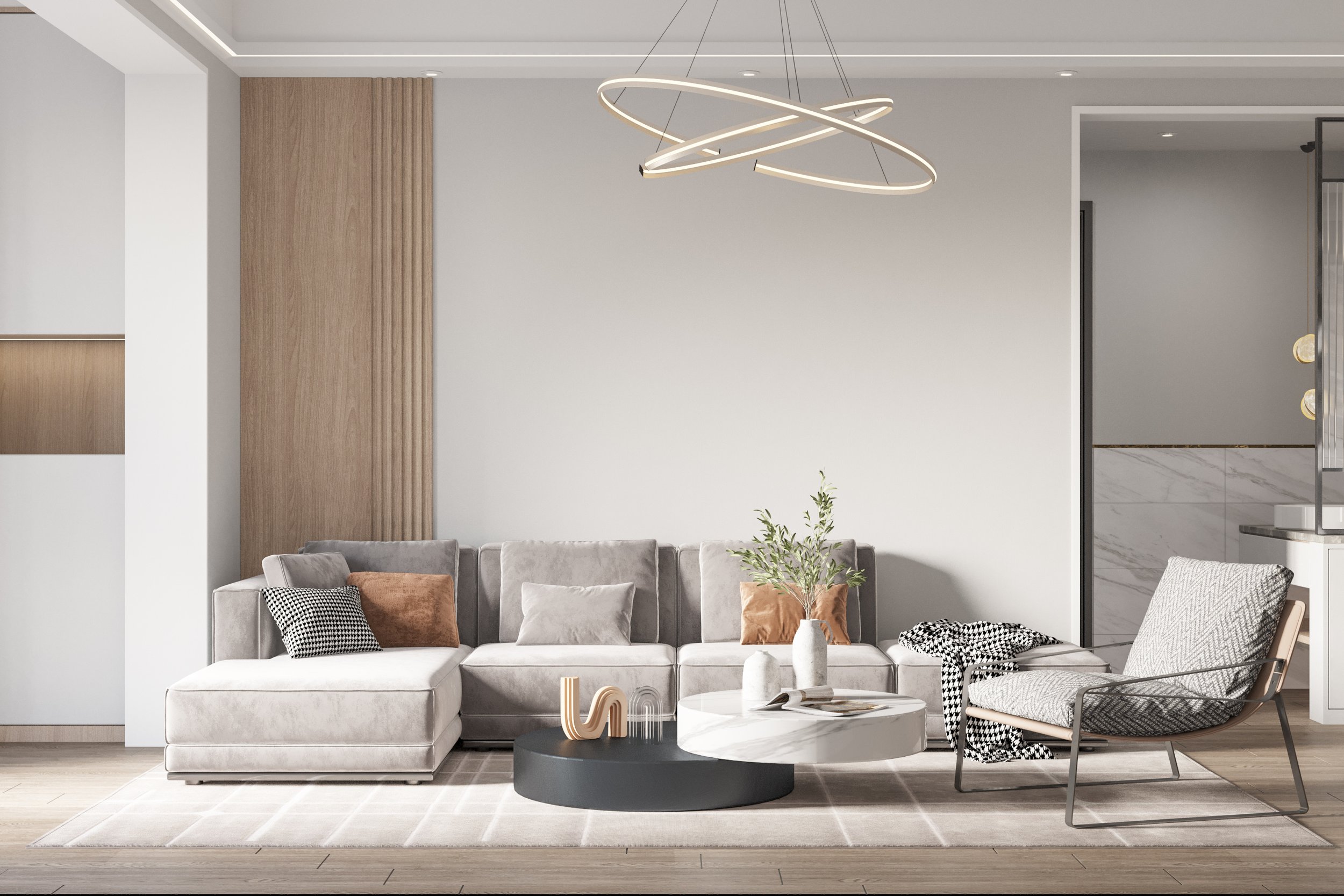 Modern living room with a gray sectional sofa, decorative pillows, round coffee table, and a geometric pendant light.