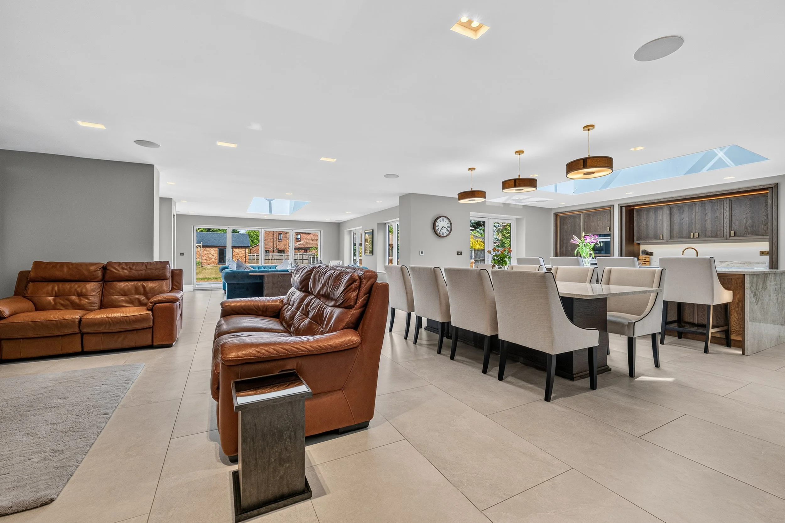 Property interior photography of a modern luxury kitchen and dining space.