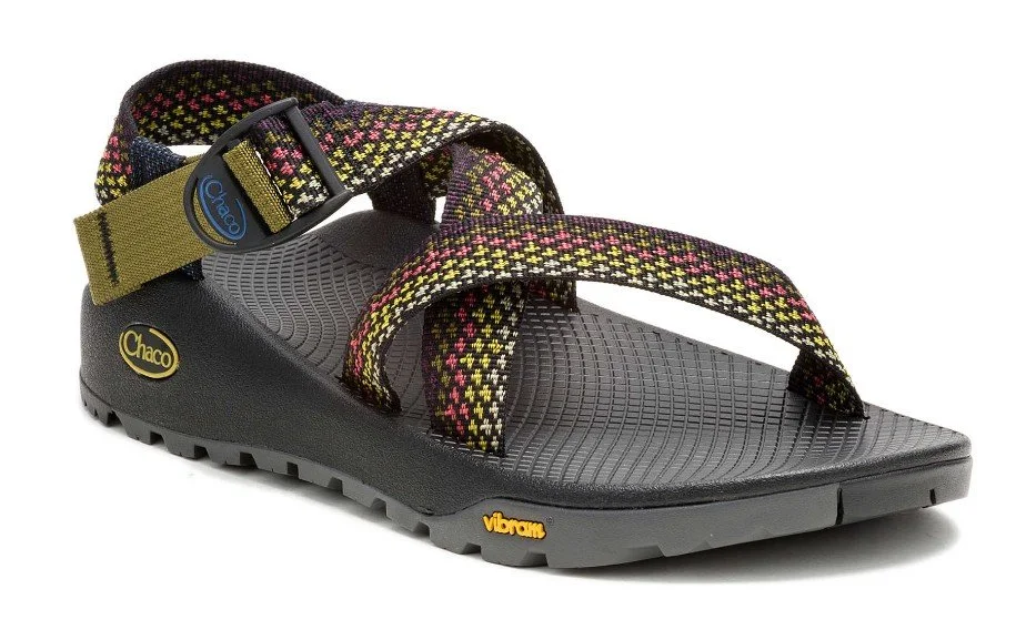 A black and multicolored strap sandal with a textured sole and Velcro strap.