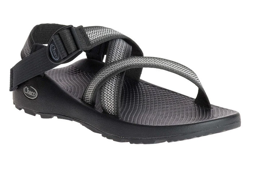 A black and gray Chaco sandals with adjustable straps and a textured sole.
