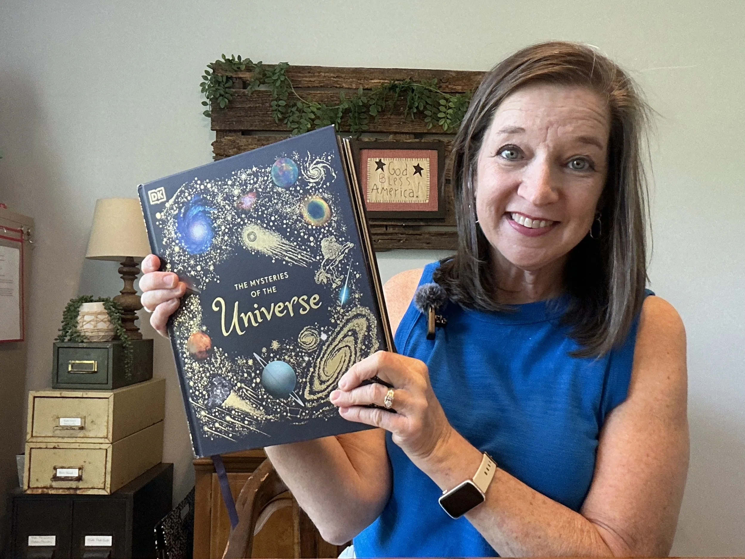 "The Mysteries of the Universe". 
An excellent book about our solar system that captivates students with amazing photos and interesting content. 