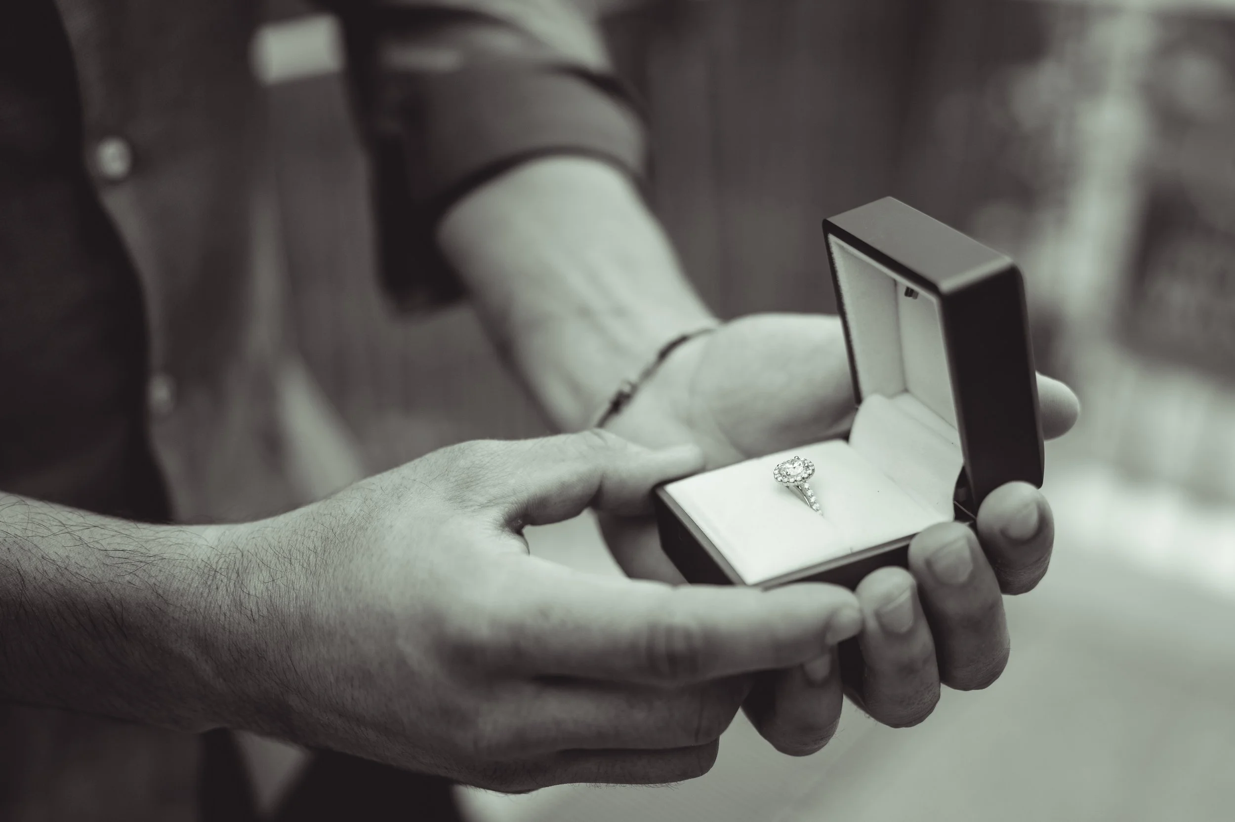 An engagement ring is displayed on the Chicago Riverwalk