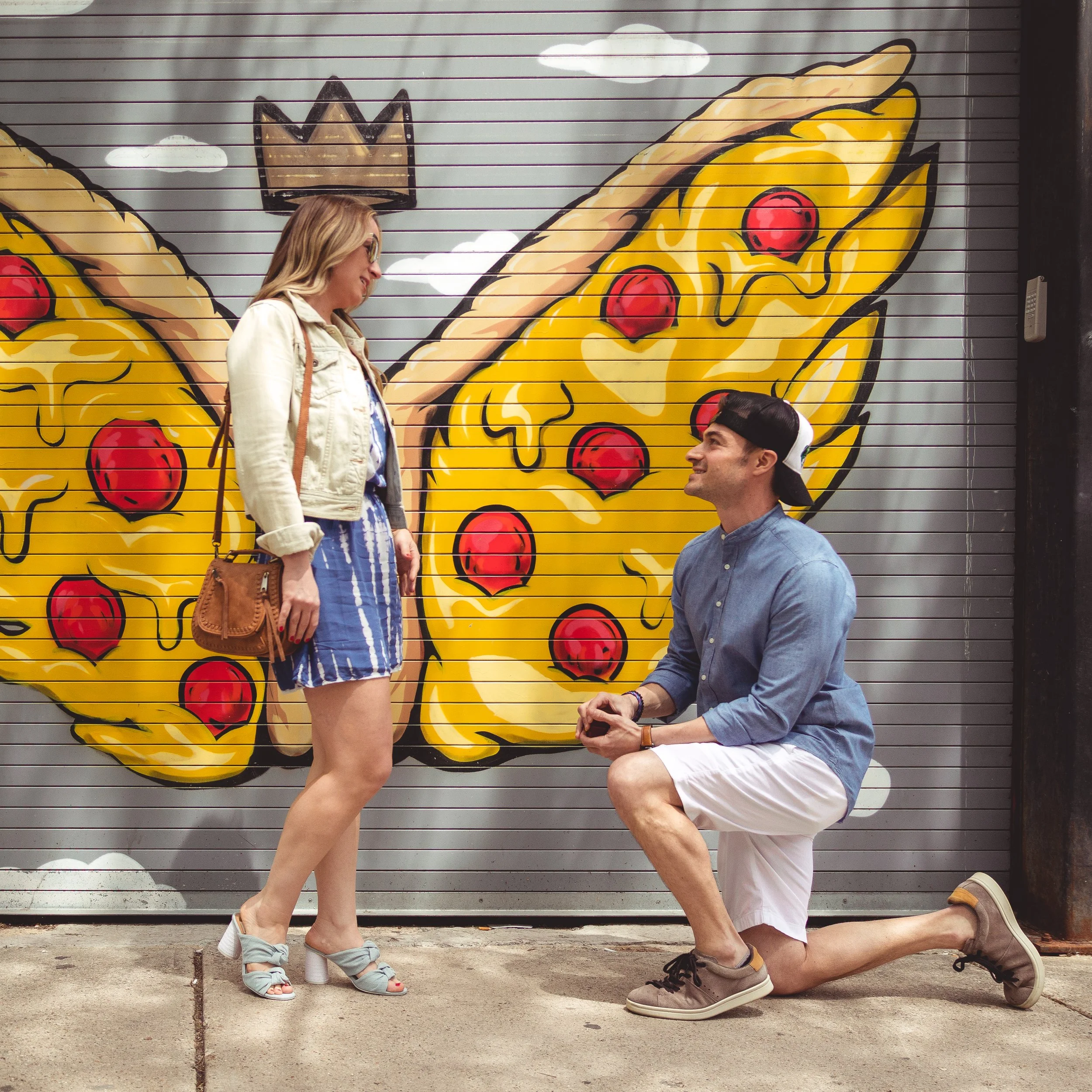 A man proposes to a woman at Parlor Pizza in West Loop Chicago, Illinois