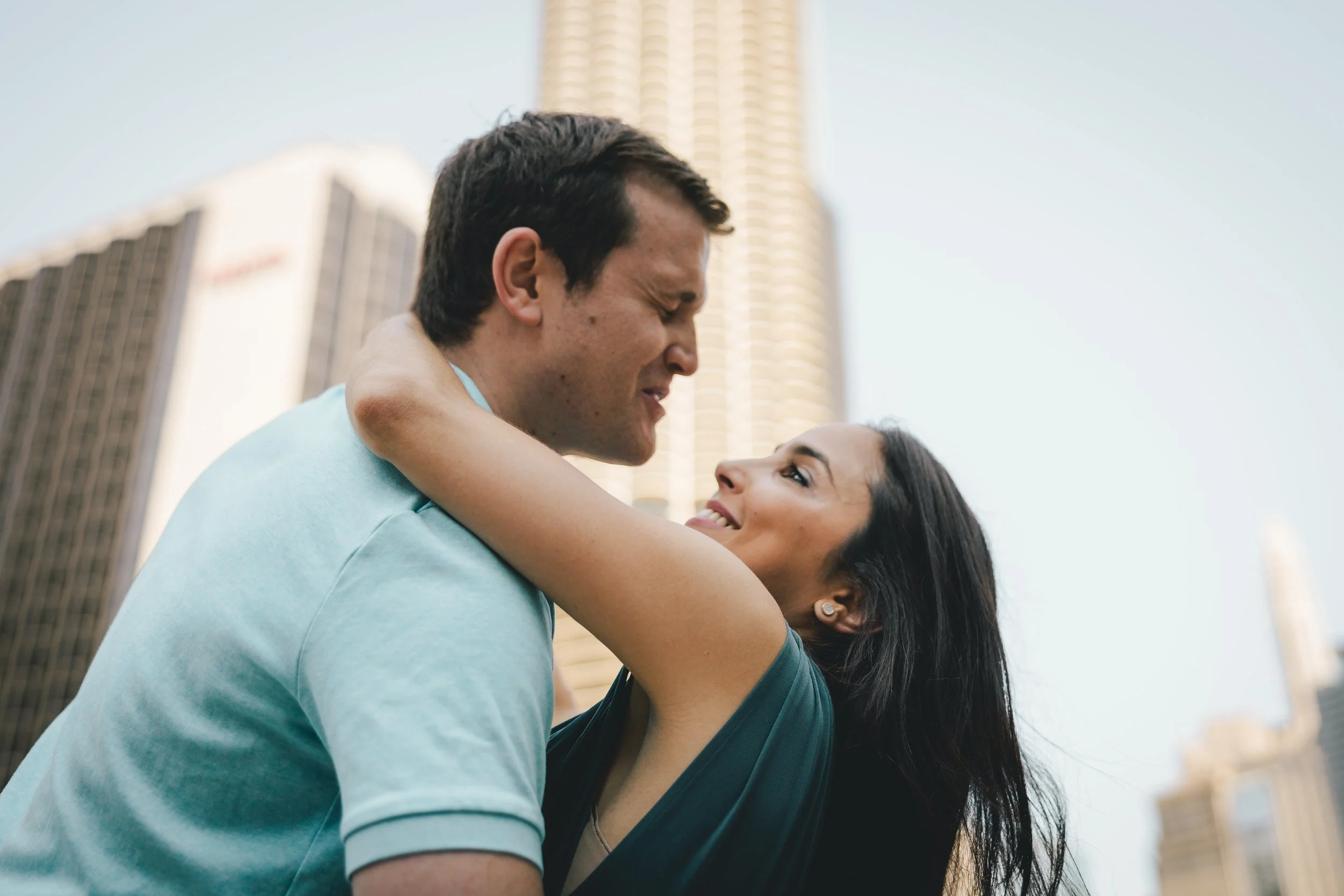 Couple walking under the skyline on the Chicago Riverwalk