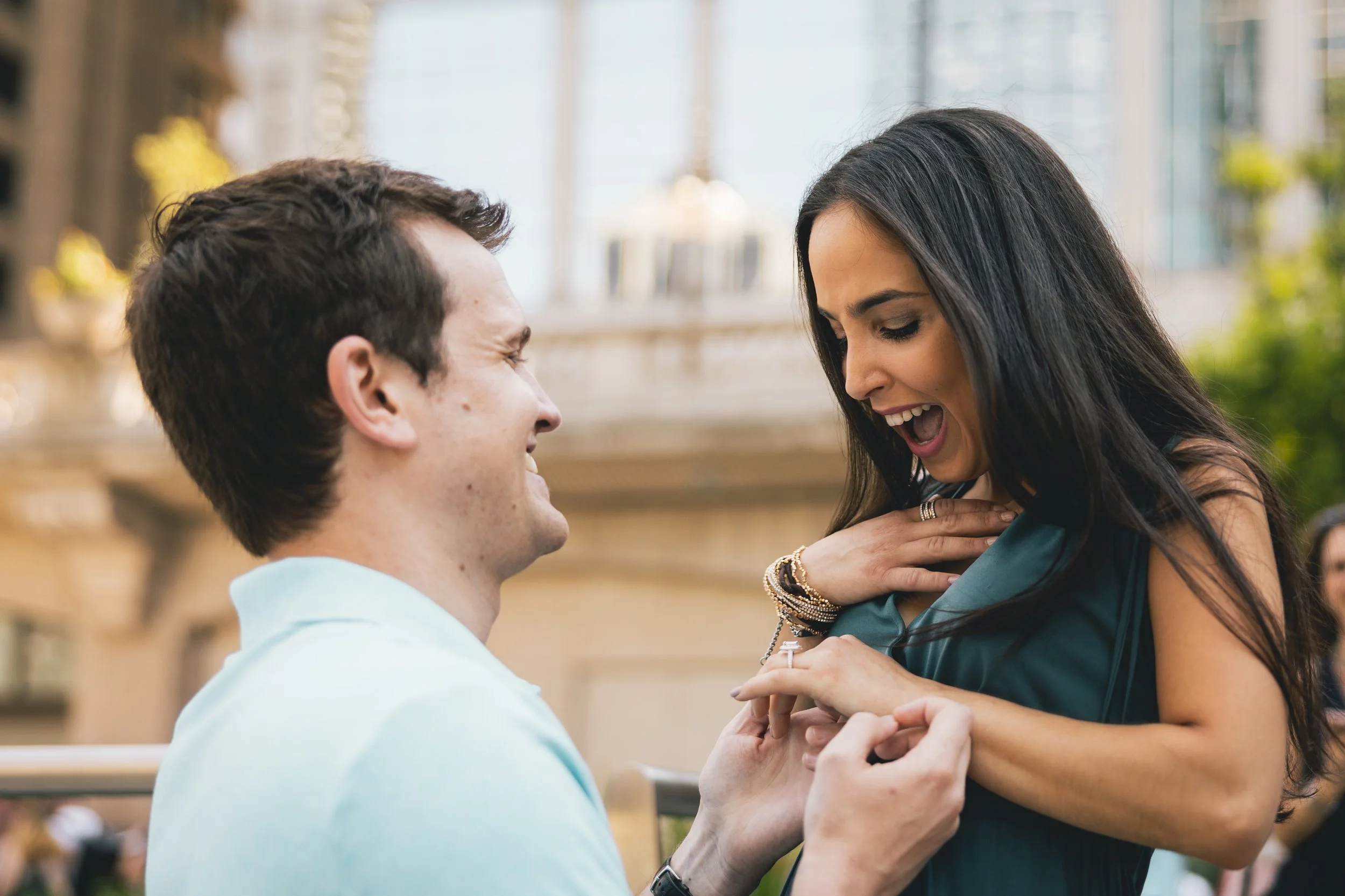 A man proposes to a woman on the Chicago Riverwalk