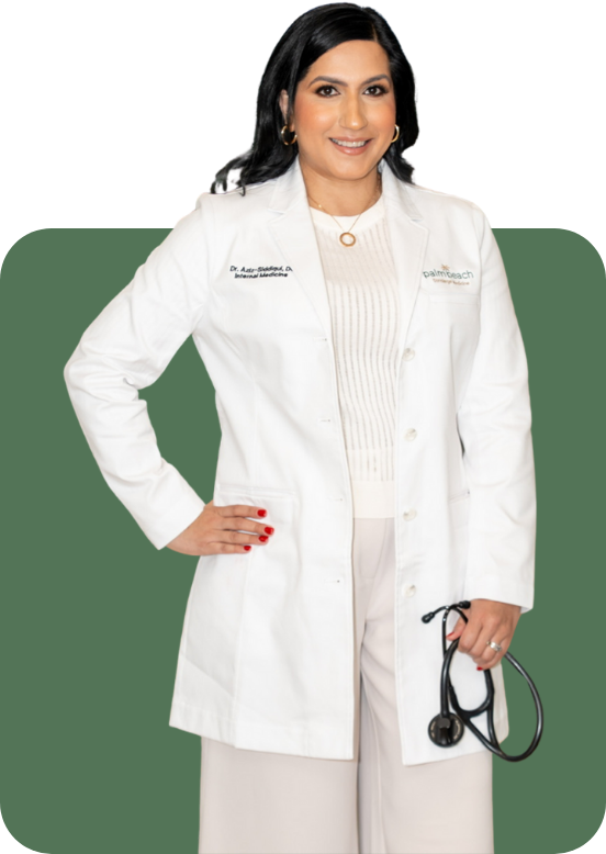 A woman in a white medical coat holding a stethoscope, smiling, with a dark background.