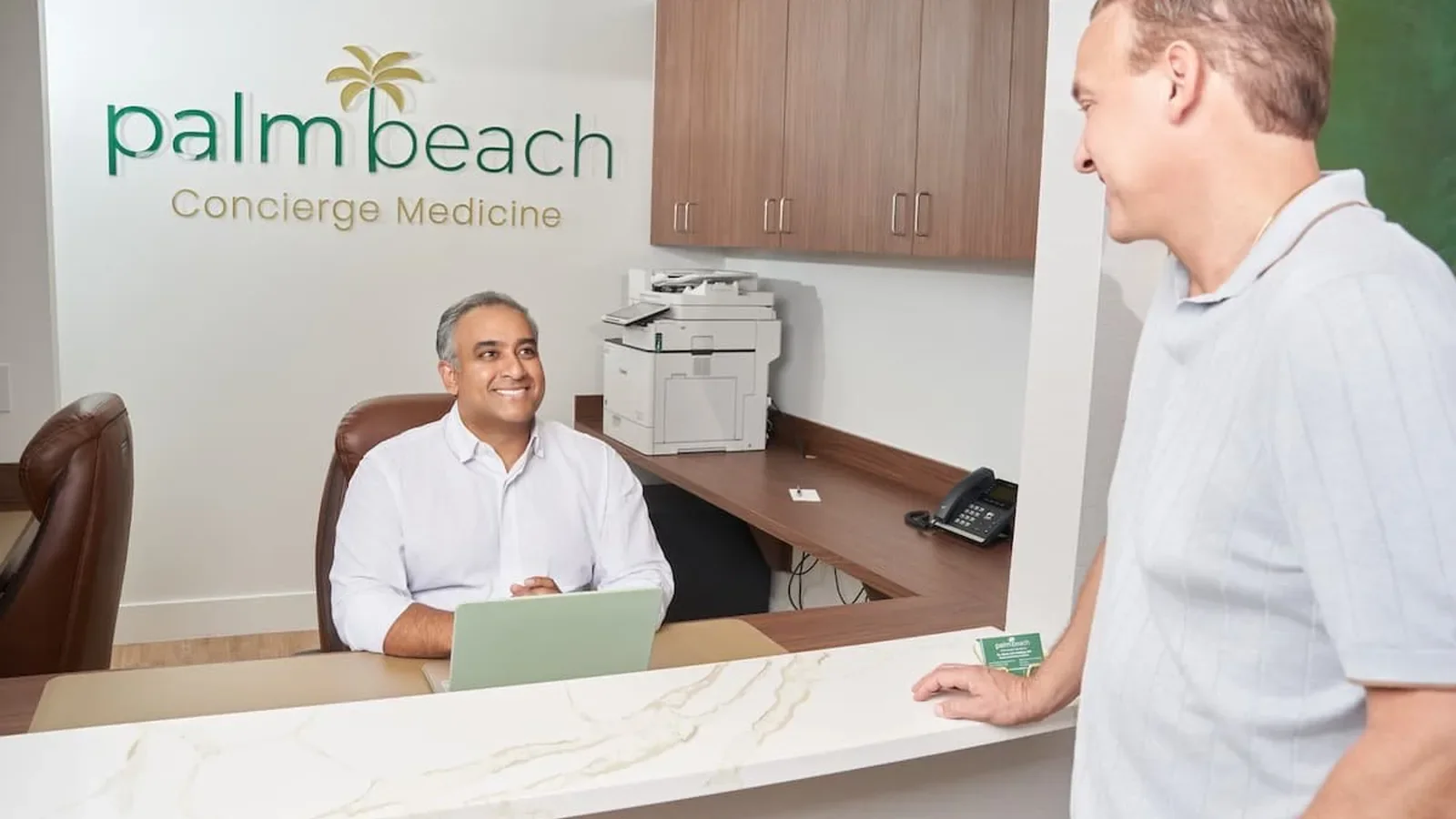 Front desk team coordinating specialist care at Palm Beach Concierge Medicine