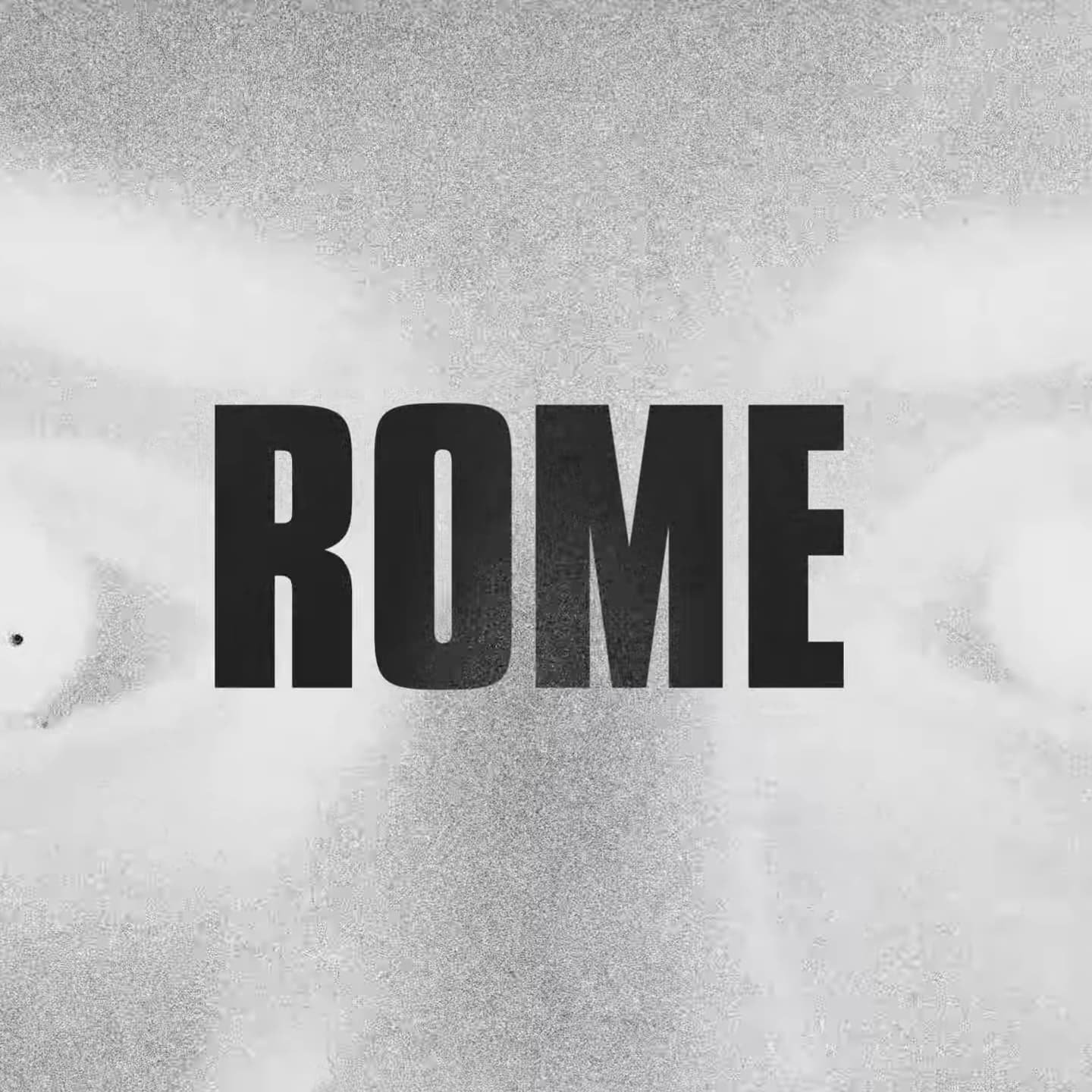 Grainy image with the word 'ROME' in bold black letters overlaid.