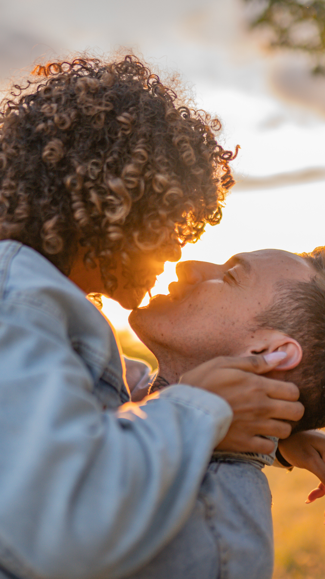 Couple kissing in front of sunset for sex therapy and intimacy