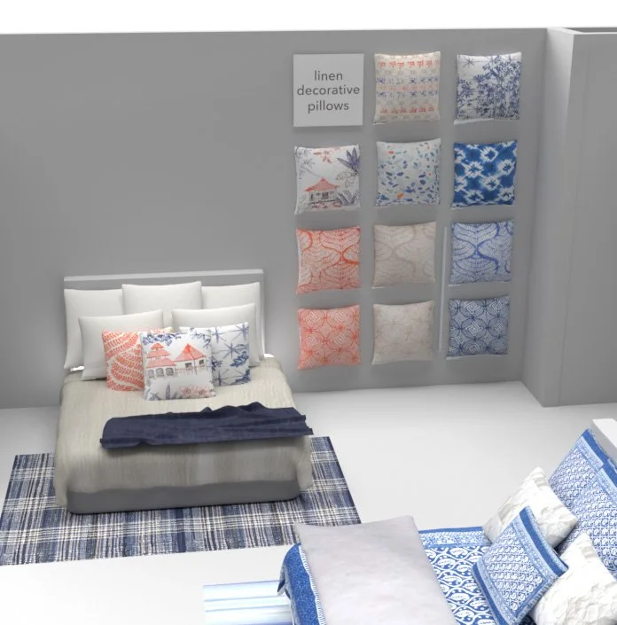 Display of linen decorative pillows in various patterns and colors, arranged on a bed and wall.