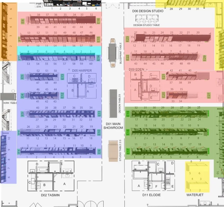 Floor plan of a showroom with various sections and color-coded areas labeled with numbers and letters, including design studios, display zones, and a waterjet area.
