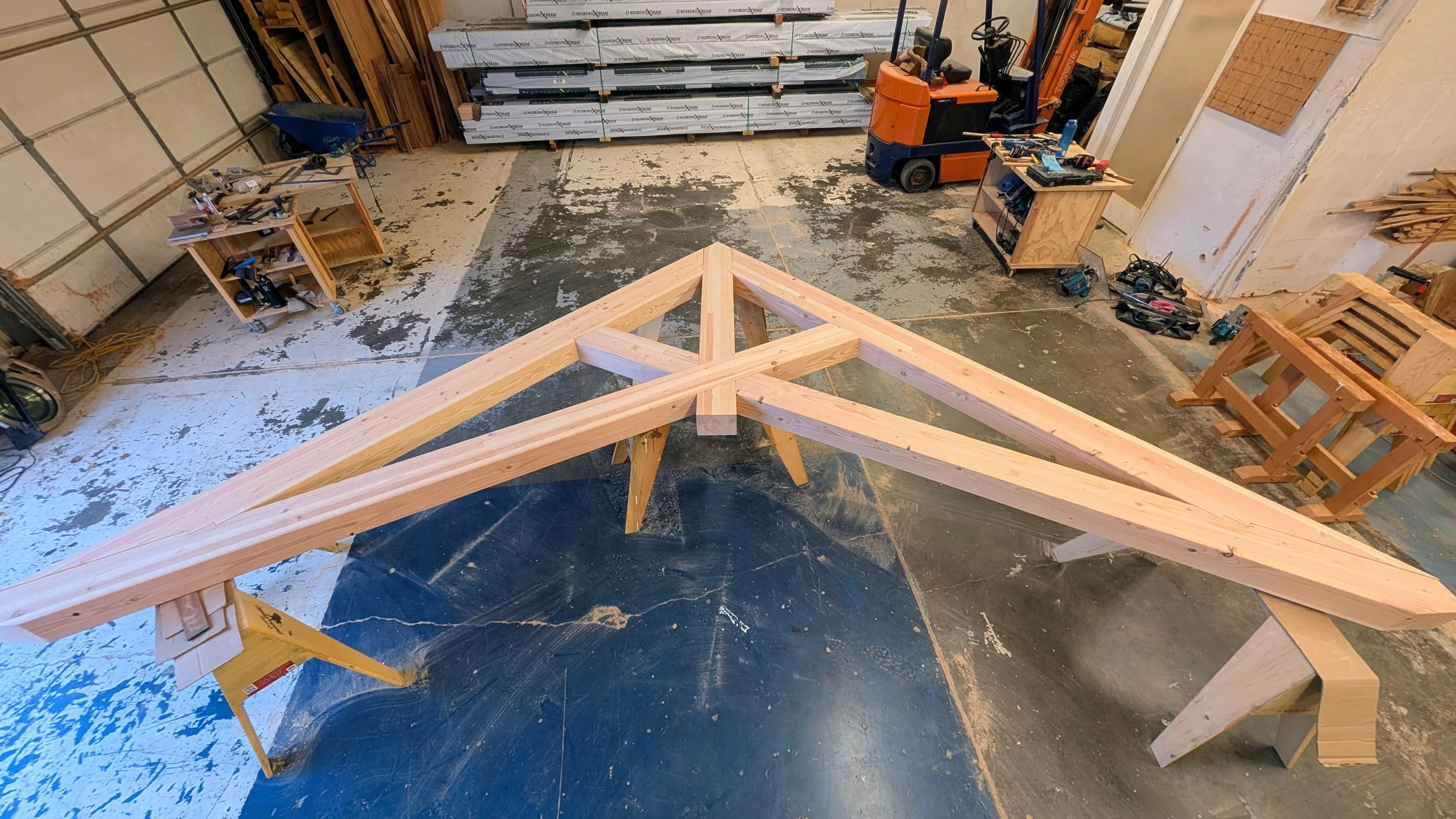 A Scissor Truss assembled in our shop, testing the fit of the joinery.