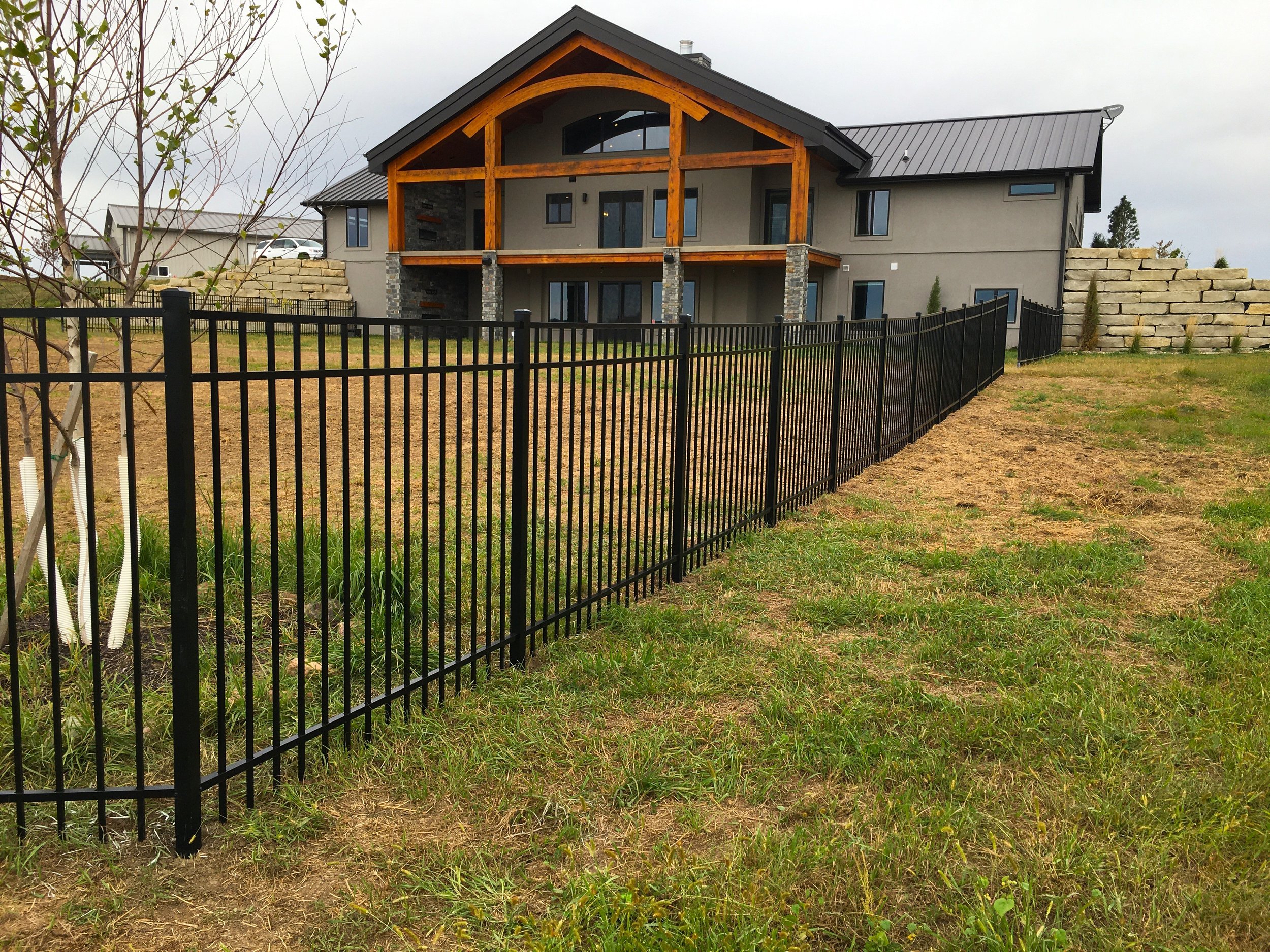 Black aluminum fence installed in front of home in Sioux Falls South Dakota