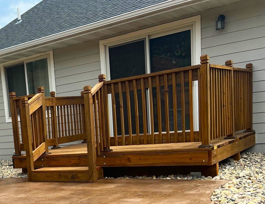 Custom wood deck with stairs and railing built by AJ&D Contracting in Sioux Falls