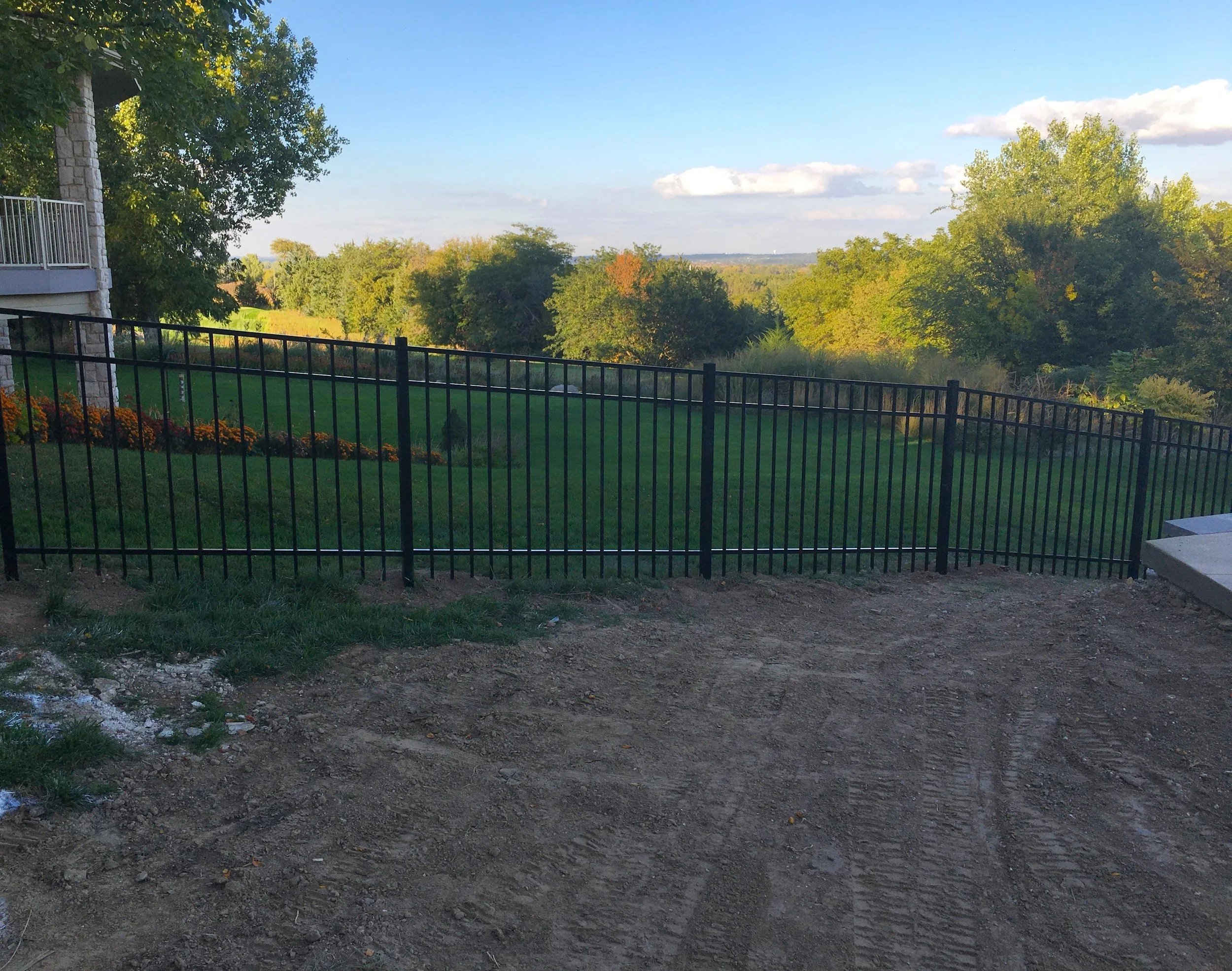 Aluminum fence installed in open landscape area in Sioux Falls South Dakota