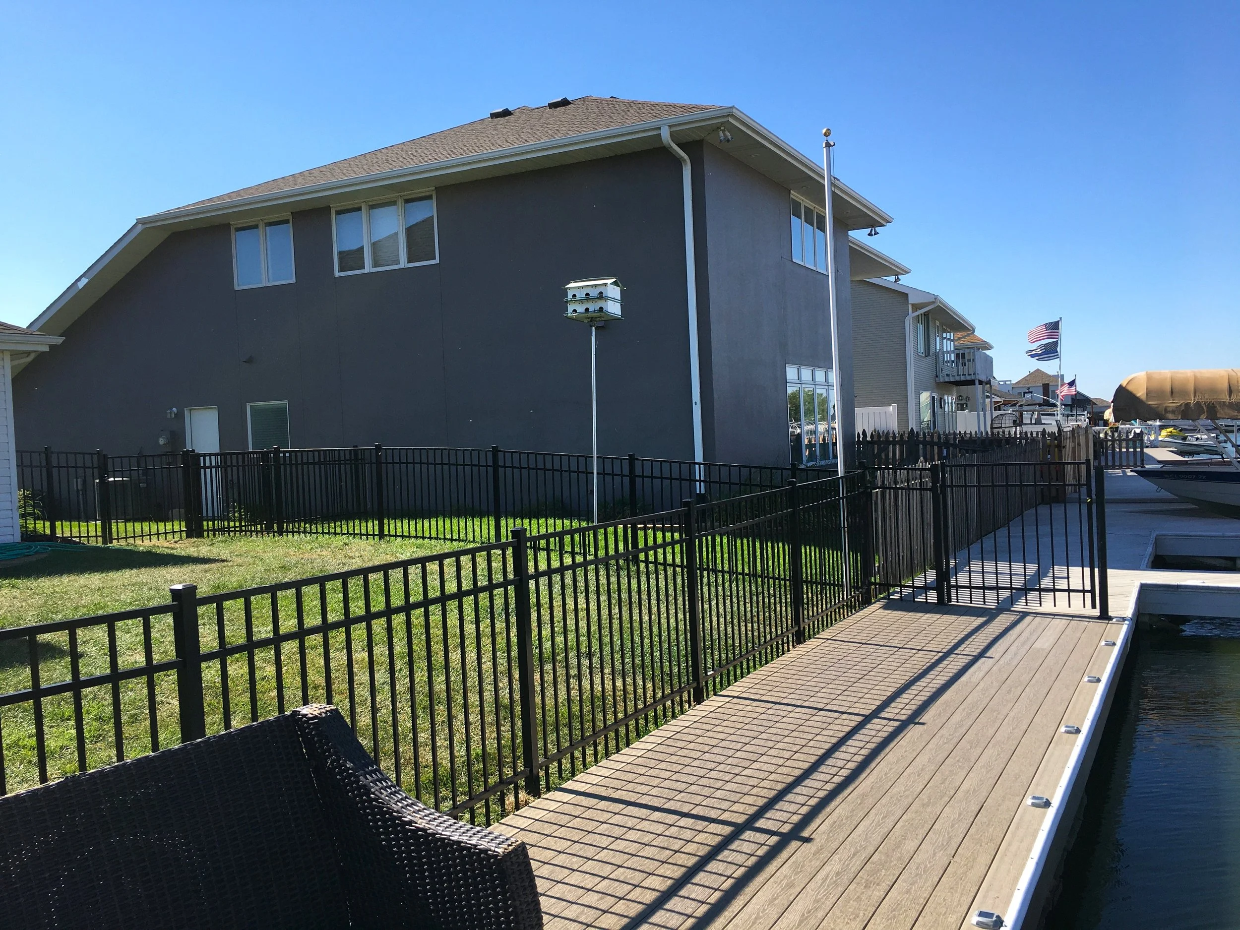 Black aluminum fence installed around deck area in Sioux Falls South Dakota