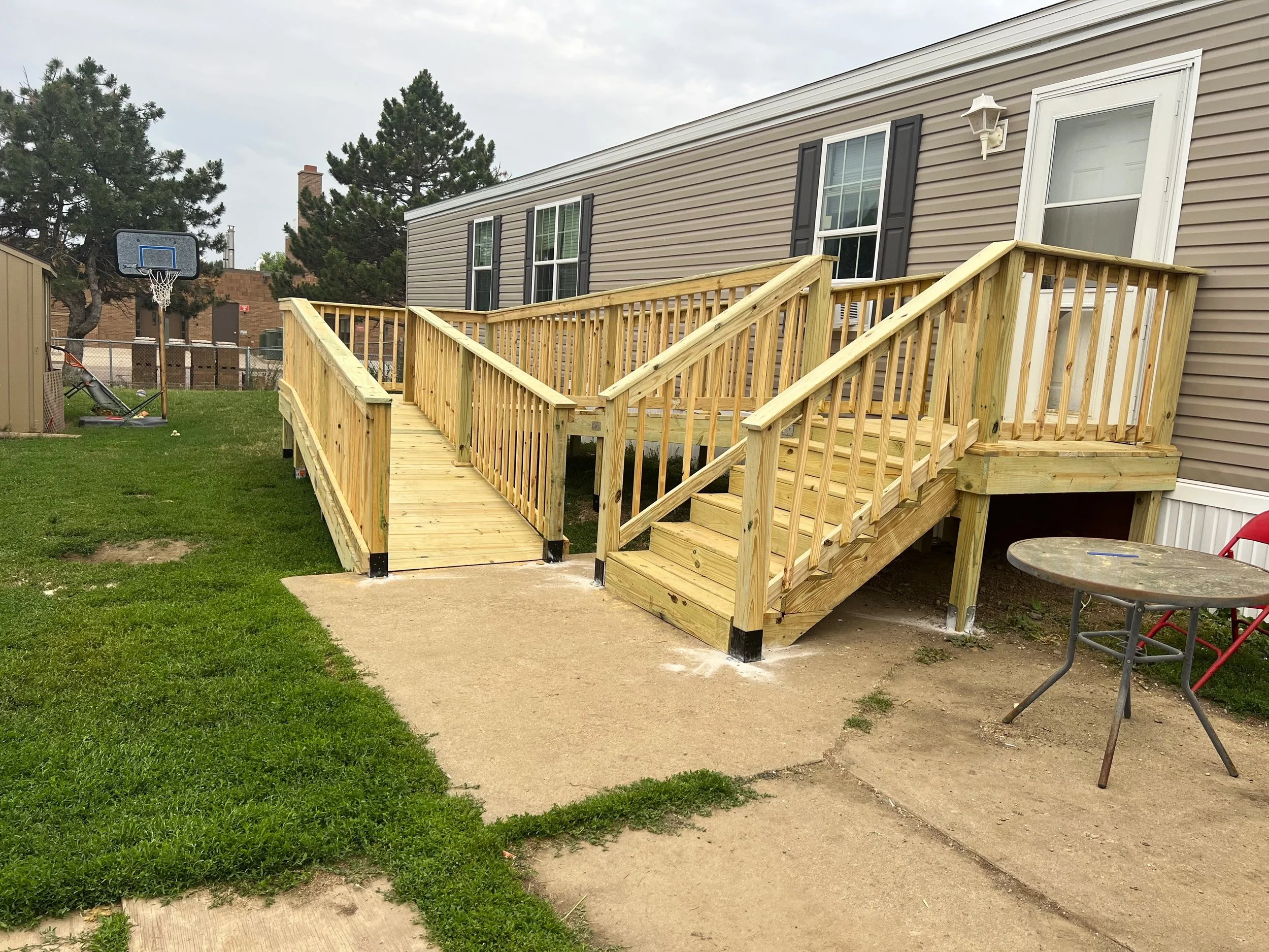 Accessible wood deck ramp and platform built for residential property