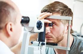 young male getting eye exam