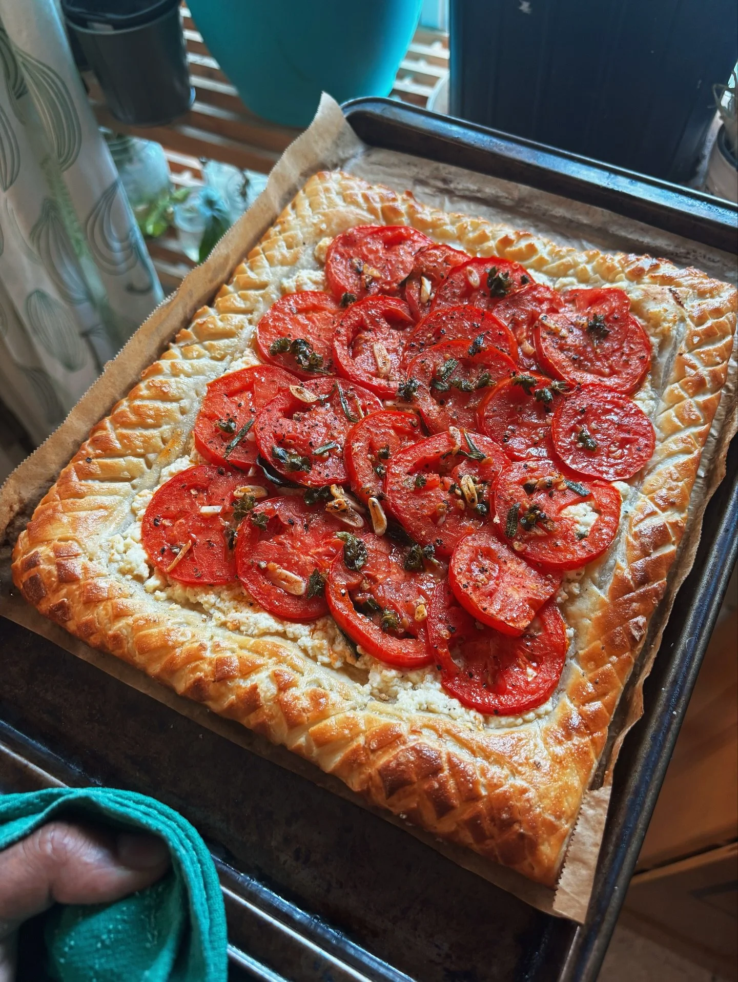 Tomato tart on puff pastry, ricotta cheese, to be finally topped off with fresh basil from my garden.
