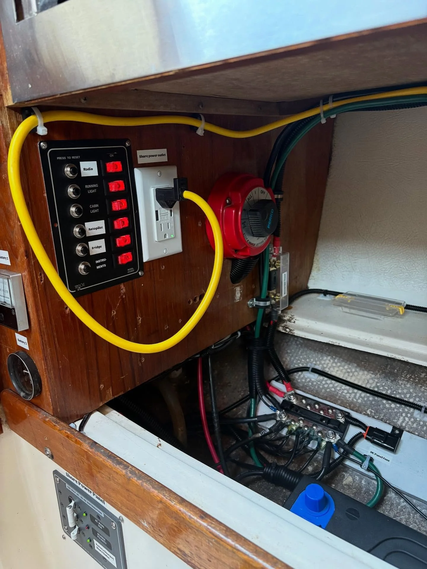 After and before this spaghetti fest of corrosion and unfused wiring. We added a new DC panel, Inverter, shore power outlet, strapped the batteries down securely, added proper fusing, and mostly rewired this boat where possible cleaning things up and
