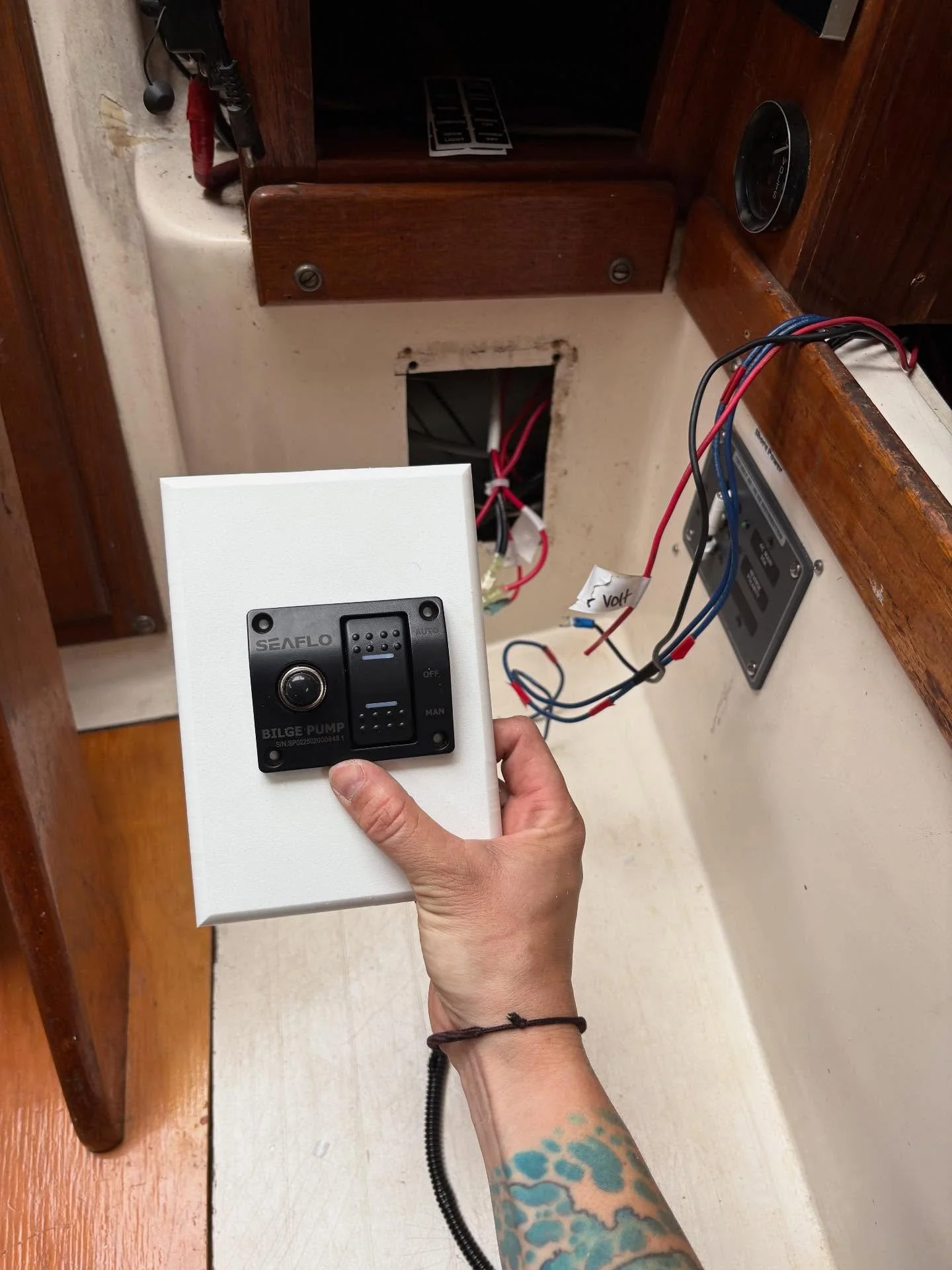 Adding shore power and panel to Catalina 27, made up a starboard panel for auto/manual bilge switch to fill existing holes