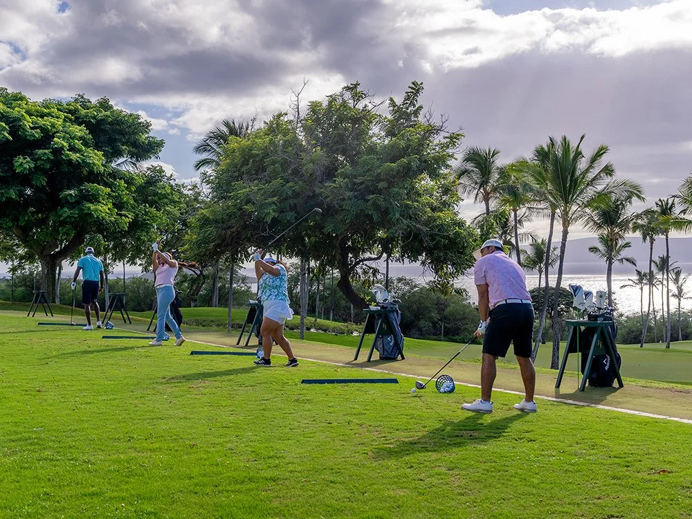 People practicing at the Wailea Golf Academy.