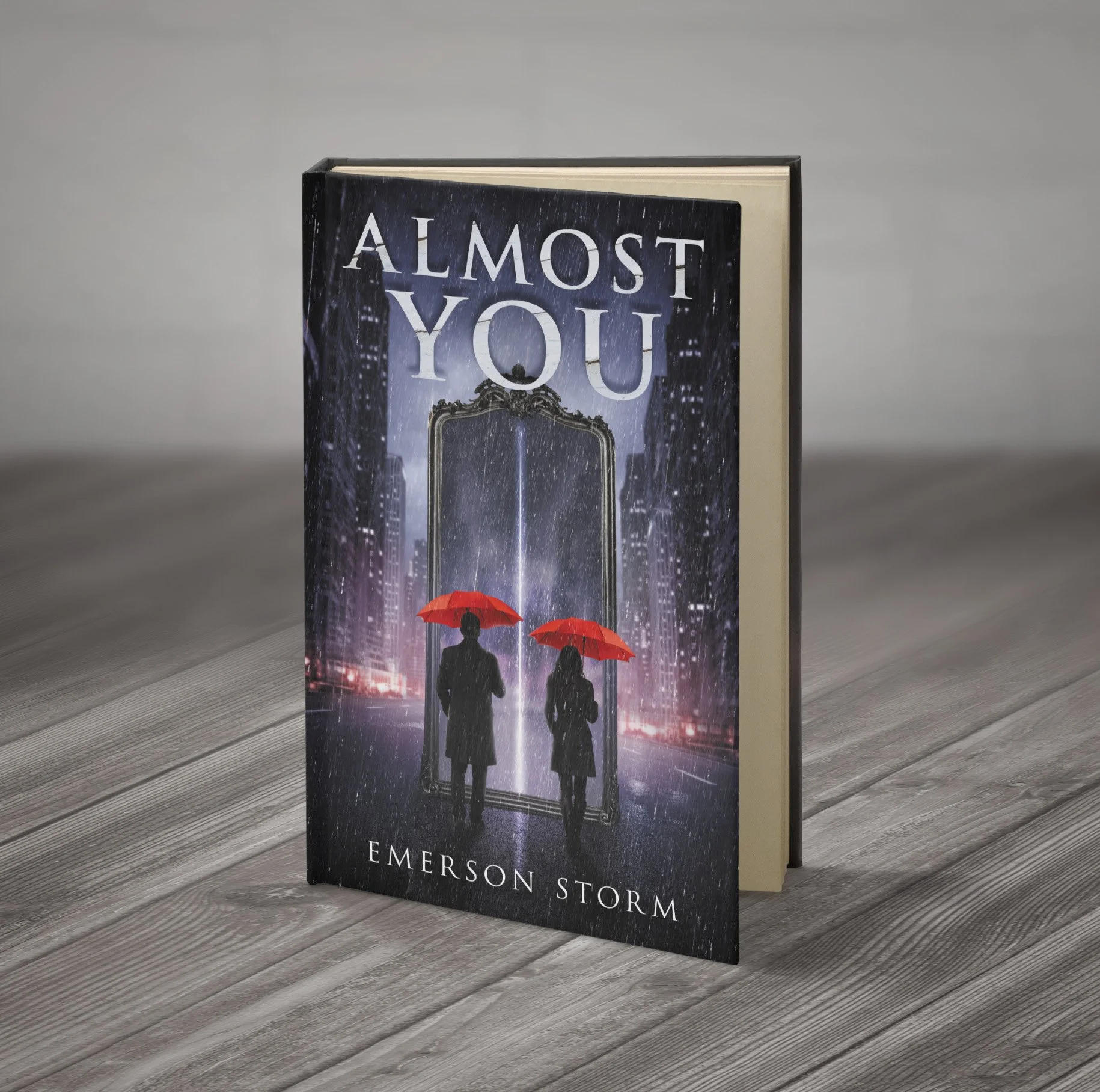 A book titled 'Almost You' by Emerson Storm standing upright on a wooden surface, featuring a cover with silhouettes of a man and a woman holding red umbrellas against a cityscape background.
