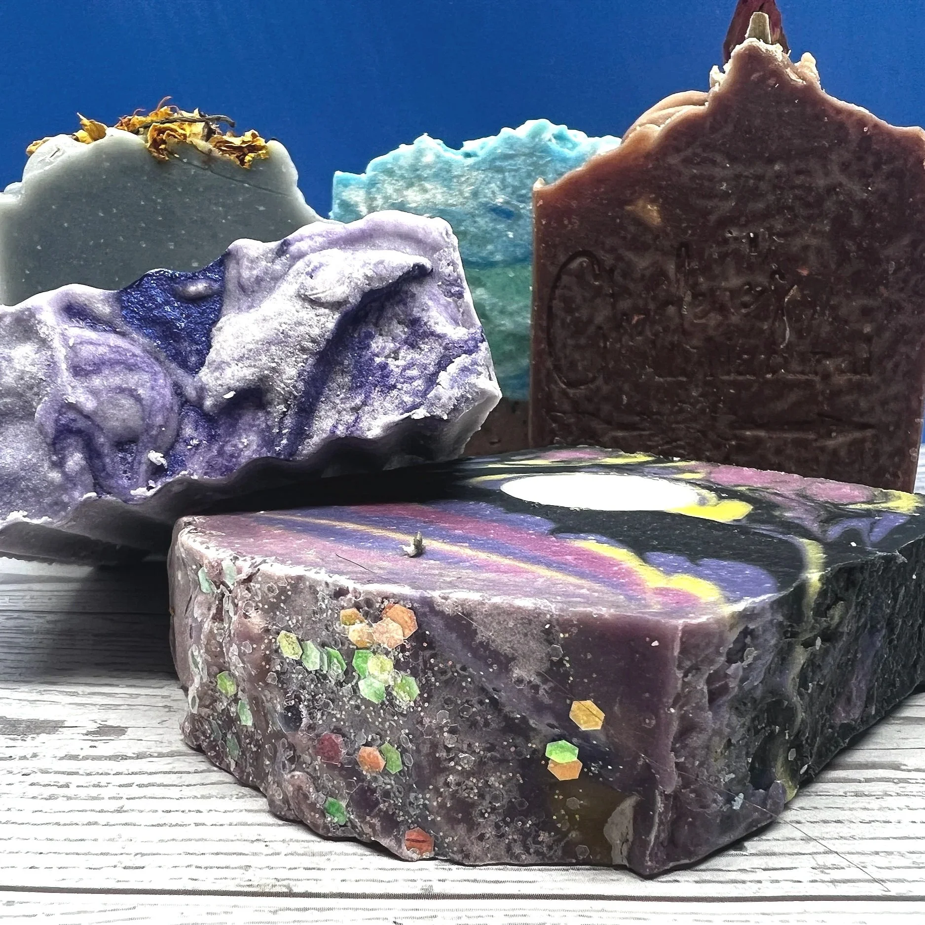 Spring Artisan Soaps: Full Moon (charged) soap, Goat Milk Milky Lavender Soap, Tropical Island Life, Natural Indigo (nourishing) Soap, and Beneficial, Rose Hip Herbal Soap