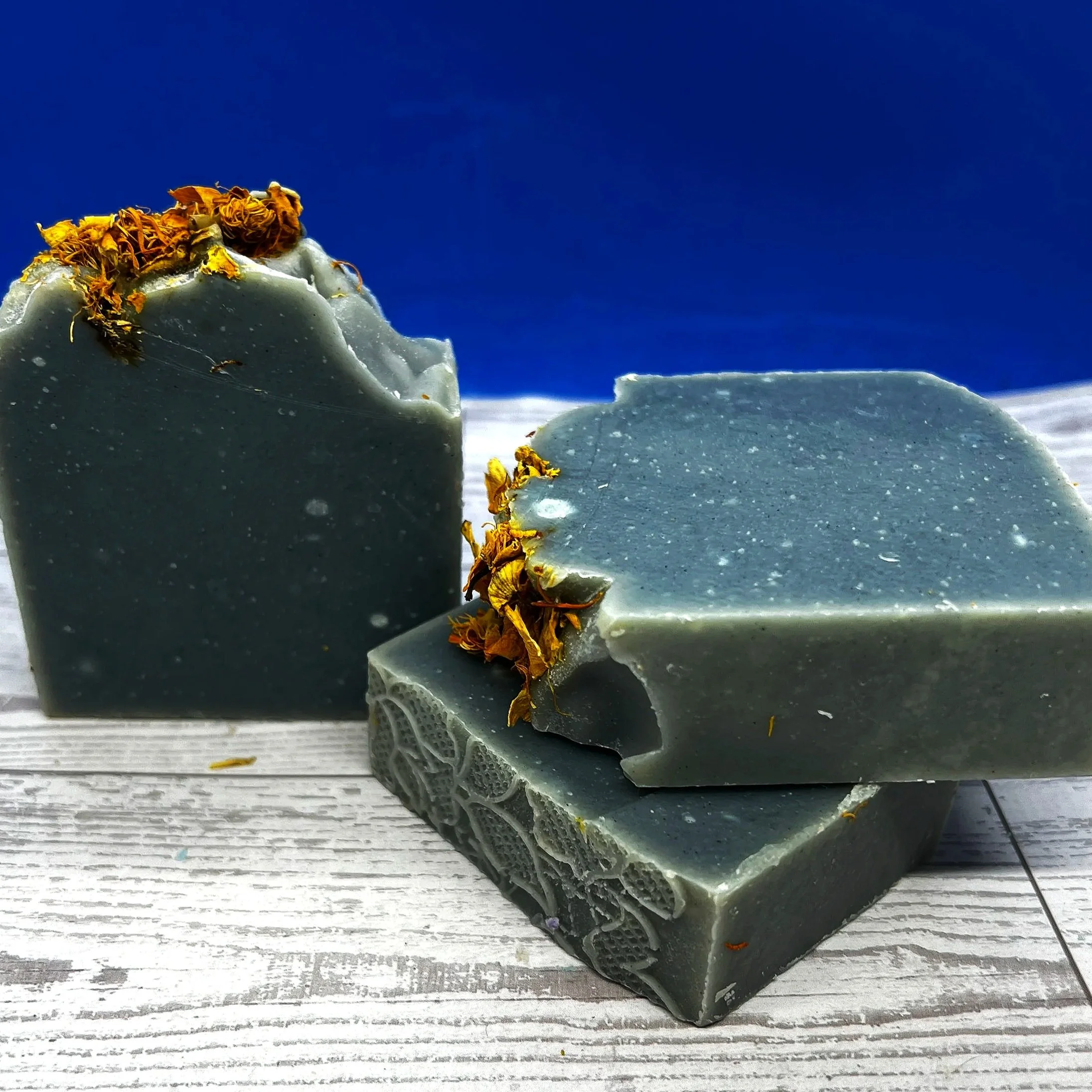 Artisan-made, Natural Indigo soap made with moisturizing Shea Butter. The scent will remind you of an aromatic walk in the woods, with a base note of Cedarwood, a middle note of Vetiver, and a touch of spice.