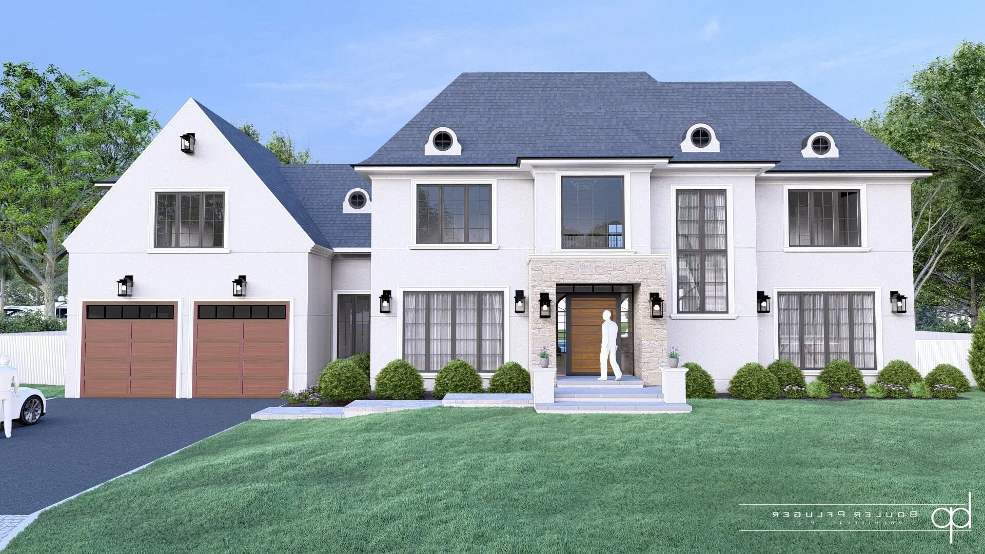 Front view of a modern two-story white house with a dark gray roof, large front windows, and a stone accent around the entrance. There is a two-car garage with wooden doors on the left, a manicured lawn, and some trimmed bushes. A person is standing at the front door.