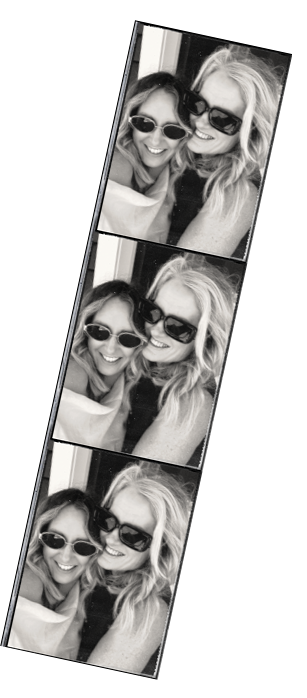 Two women taking a series of black and white photo booth pictures, both wearing sunglasses and smiling.