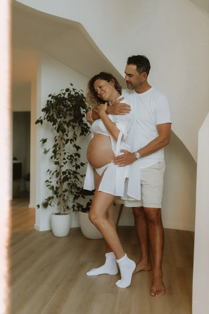 in home maternity session, capture of mum and dad dancing