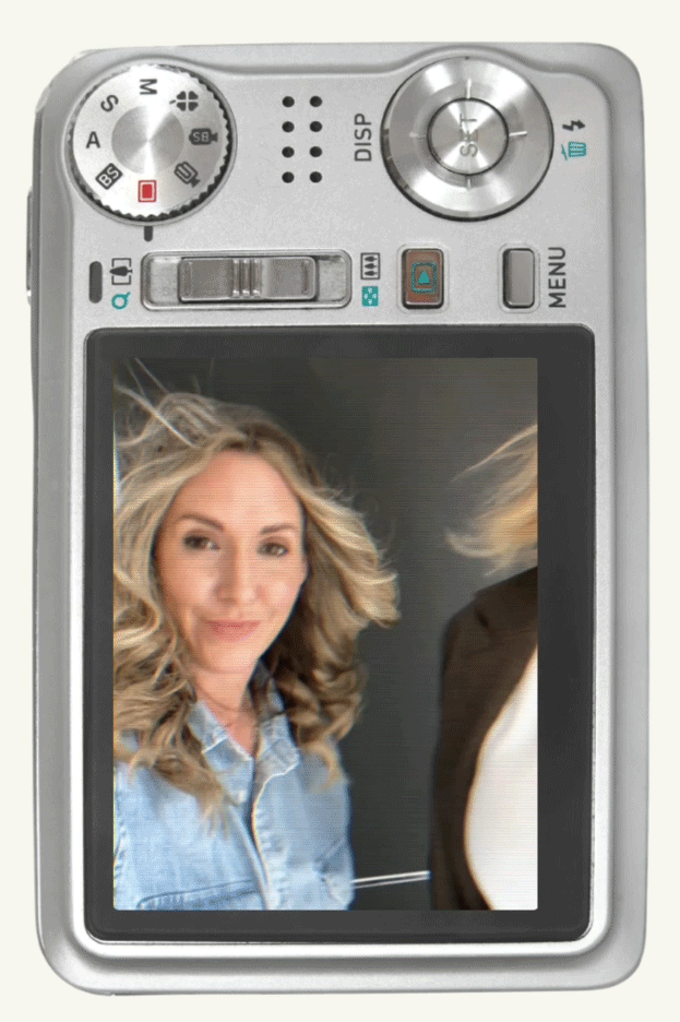 Digital camera displaying a photo of a woman with blonde curly hair, wearing a denim shirt, and smiling.
