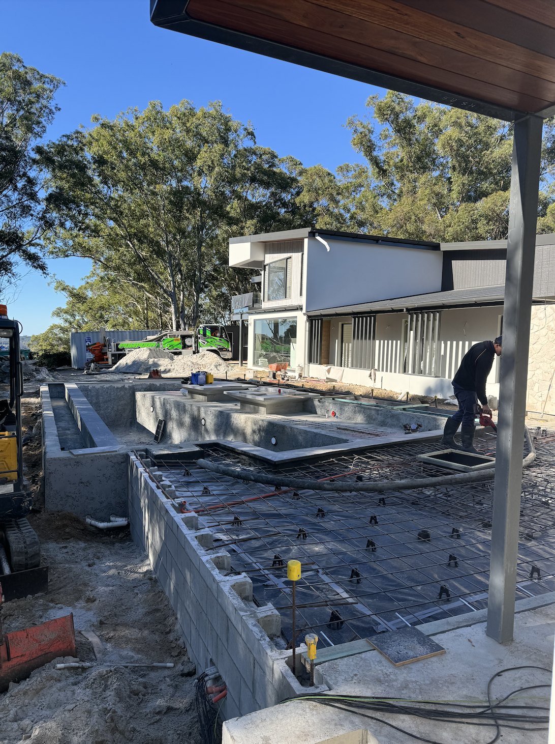 Gold Coast concreters prepping concrete pool surroundings in Palm Beach.