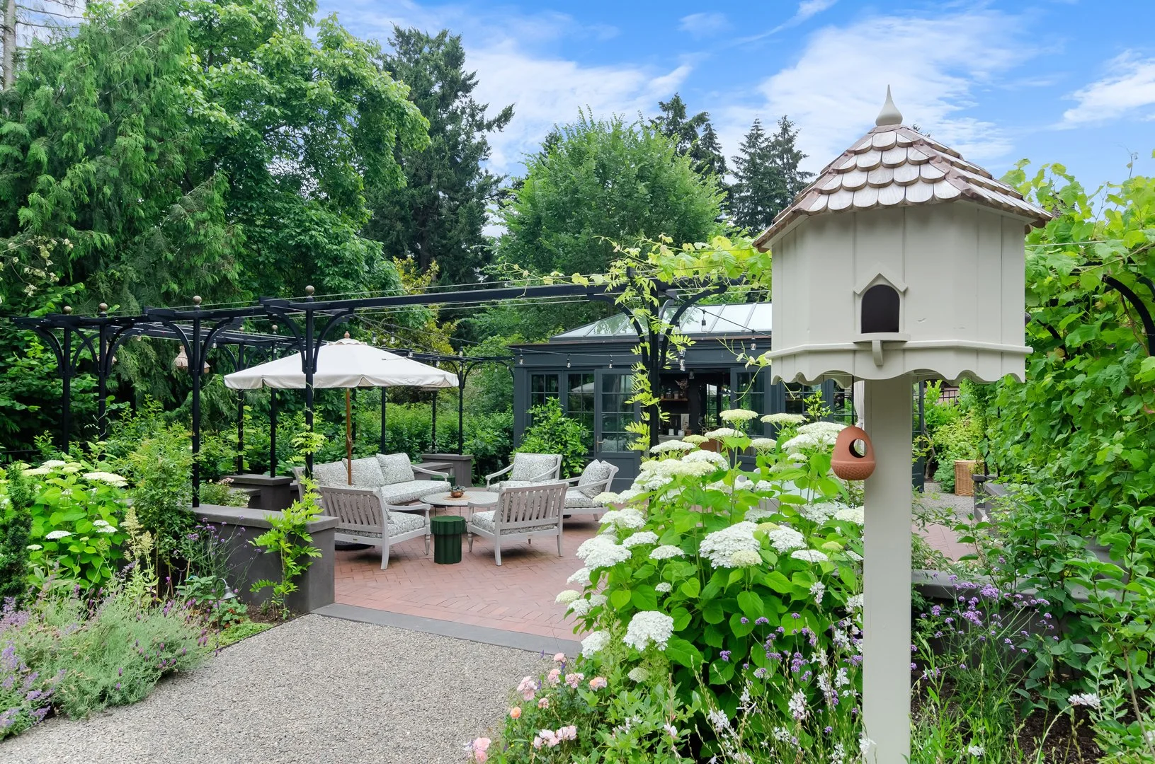 A custom-made dovecote is one of many structures in the garden meant to welcome wildlife.