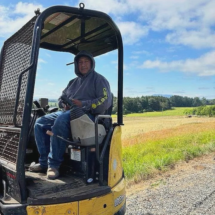 Luis Susano operating a construction vehicle on one of his sites.