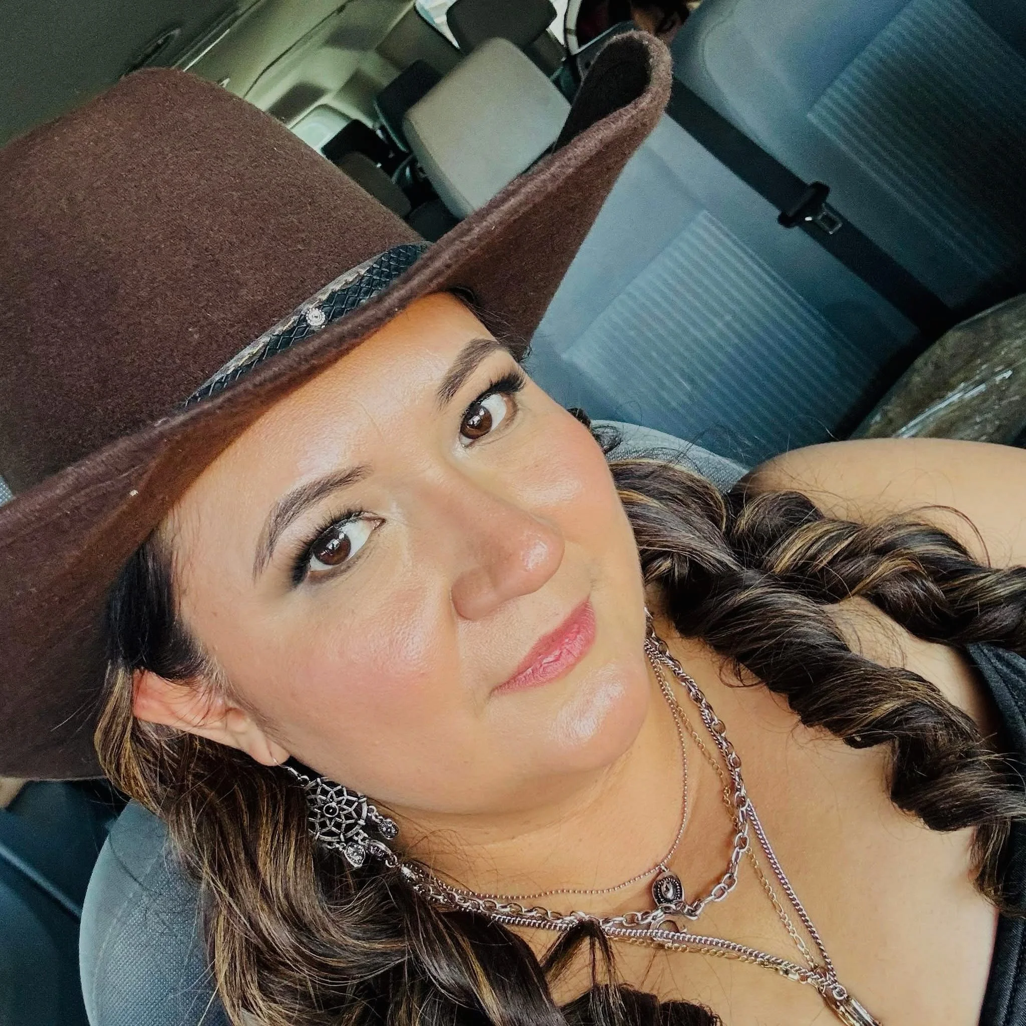 Araceli Susano in a brown hat