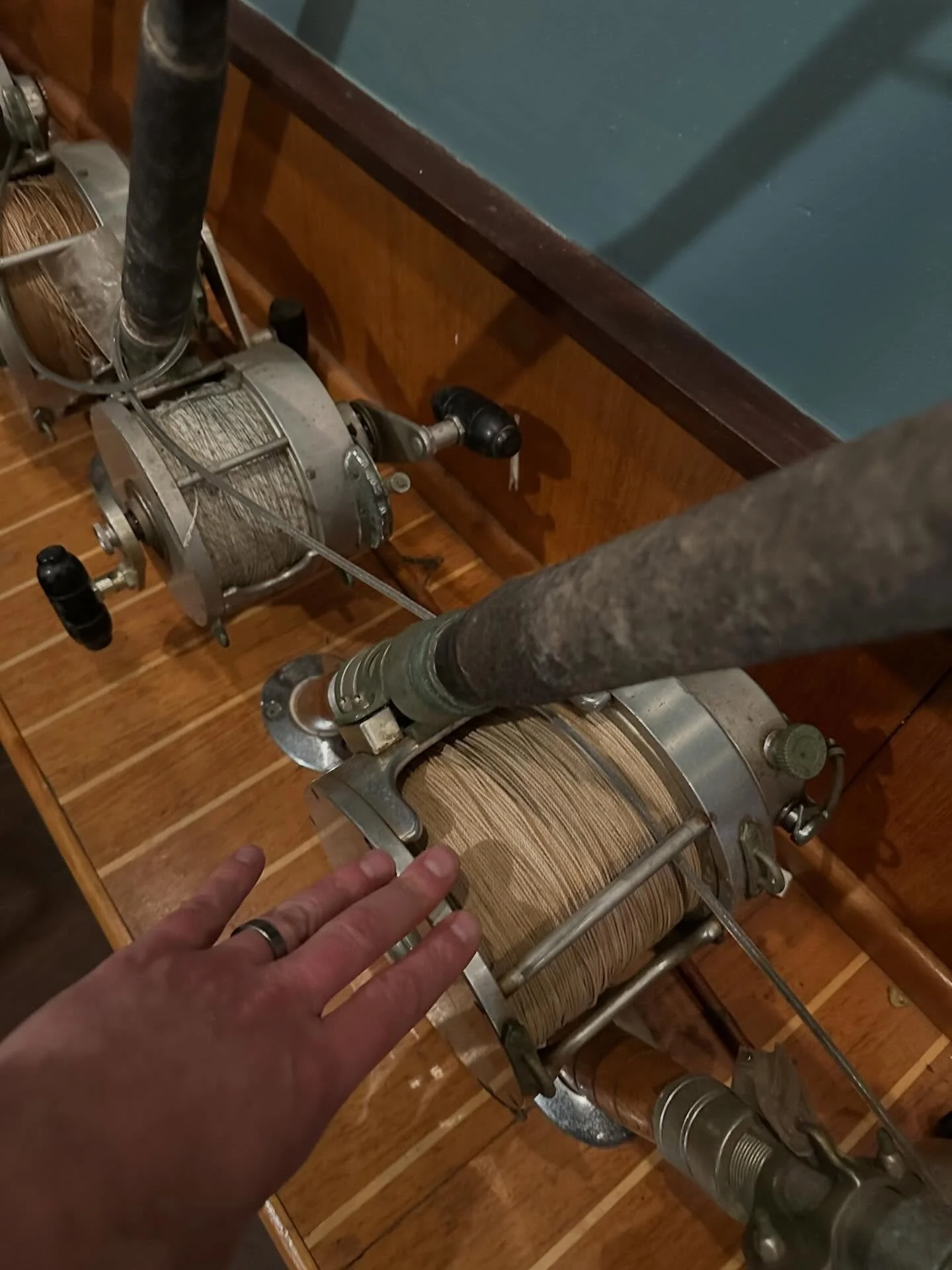 Some of the biggest reels I&rsquo;ve ever seen. I had to put my hand in there for scale. Time for Marlin fishing old school style!