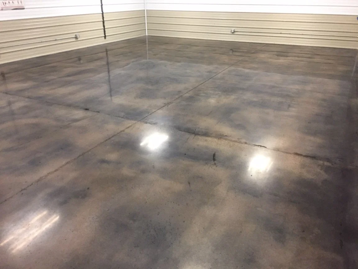 Polished concrete floor in an empty room with beige and white walls.
