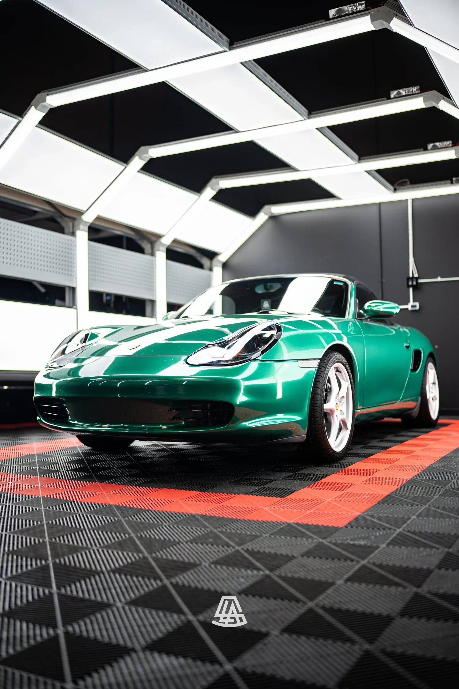 Porsche in a gloss green vinyl wrap at the Luminous Auto Salon shop in Calgary