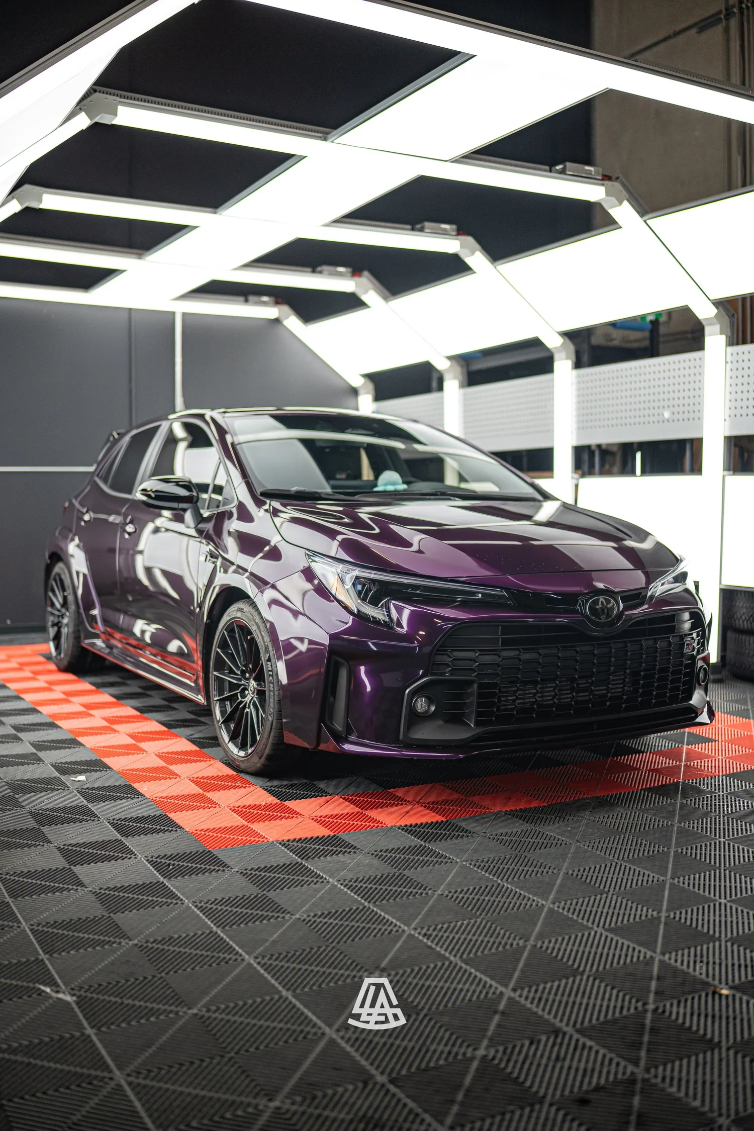 Hatchback in a deep purple vinyl wrap at the Luminous Auto Salon shop in Calgary