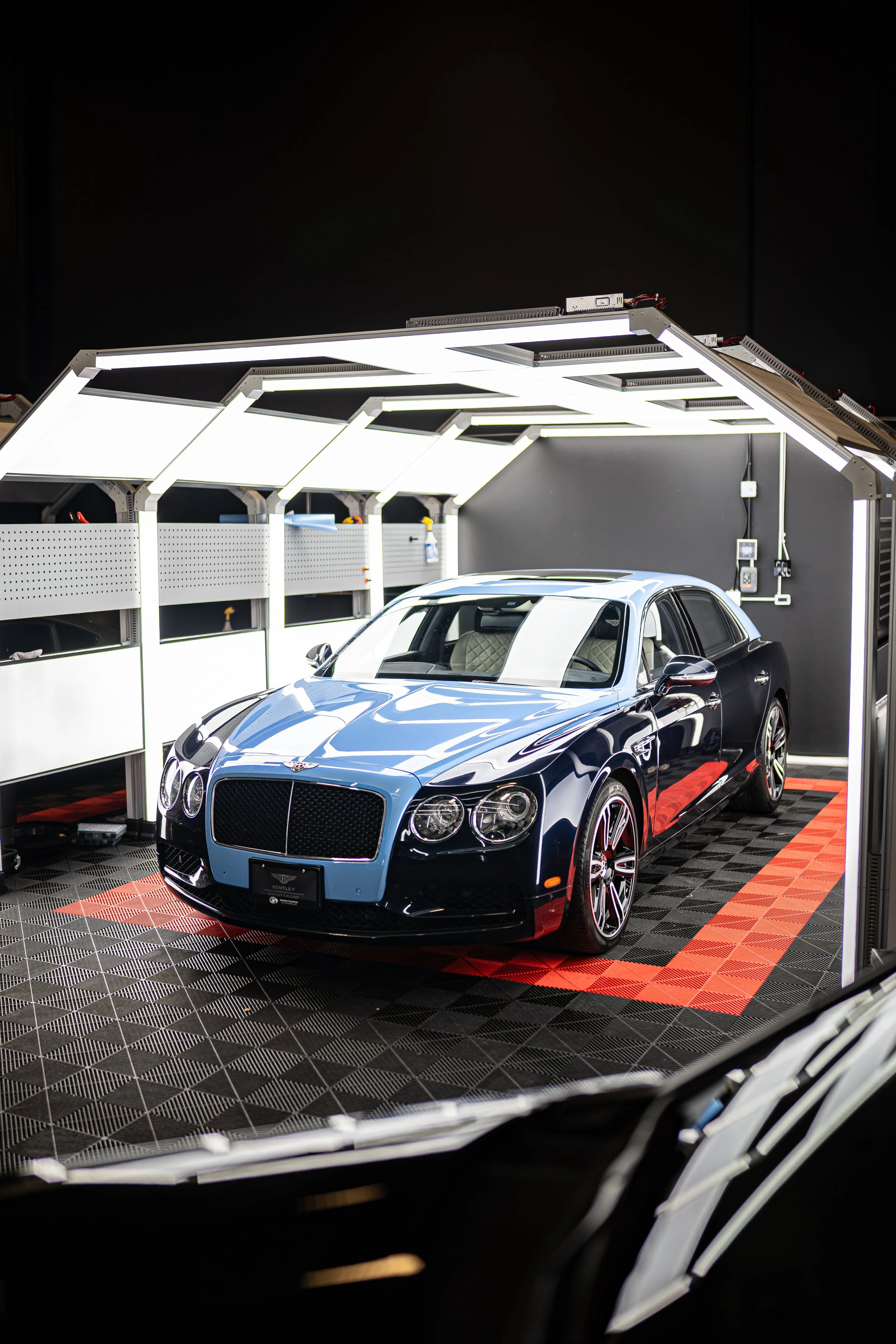 Two-tone blue and black colour change wrap on a luxury sedan in the Luminous Auto Salon Calgary studio