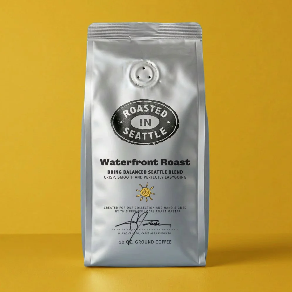 Silver bag of roasted coffee labeled 'Waterfront Roast' from Seattle, with a yellow background.