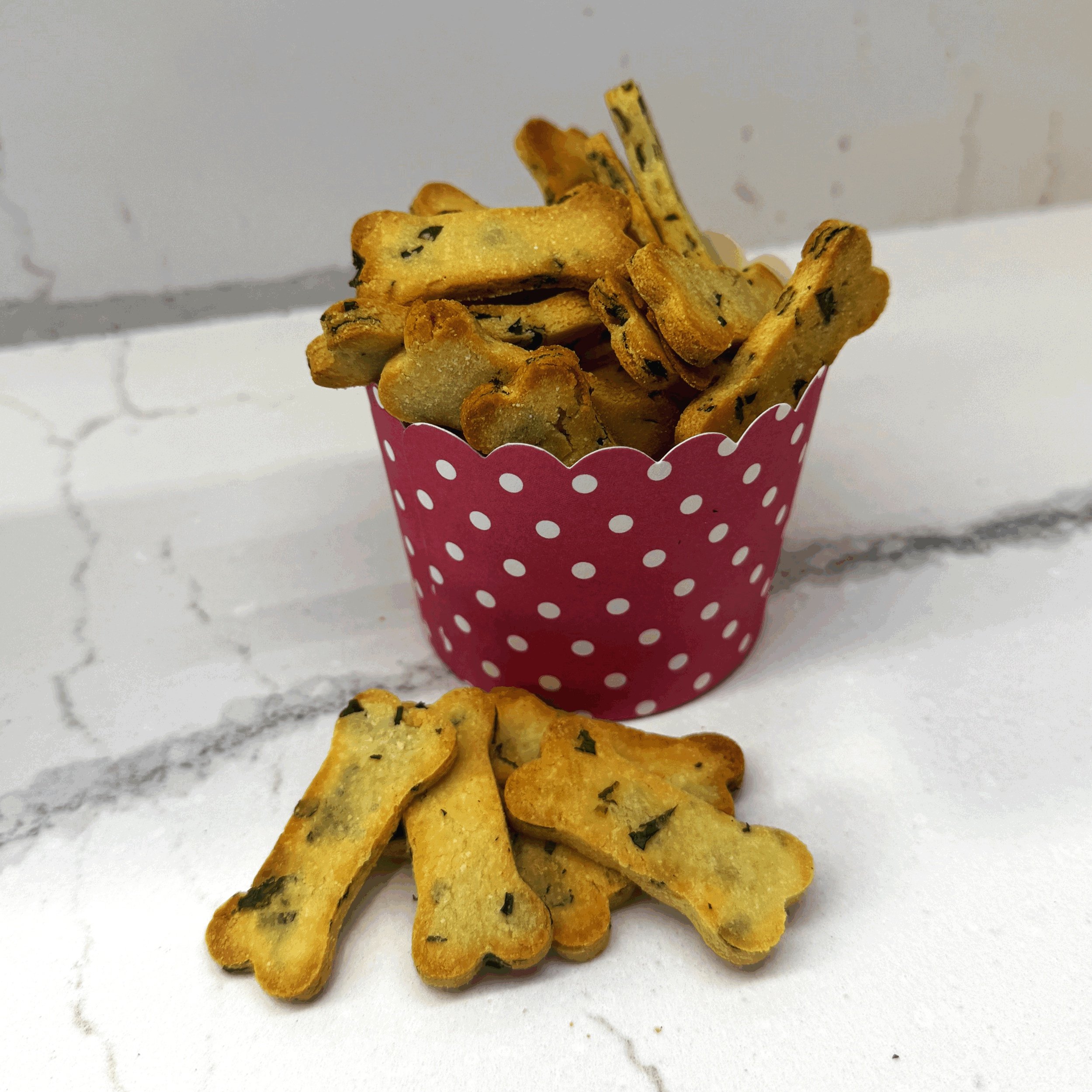 Homemade fresh mint dog biscuits made in Ottawa with organic rice flour, coconut flour, organic virgin coconut oil, and natural honey, offering a healthy and flavorful treat for dogs