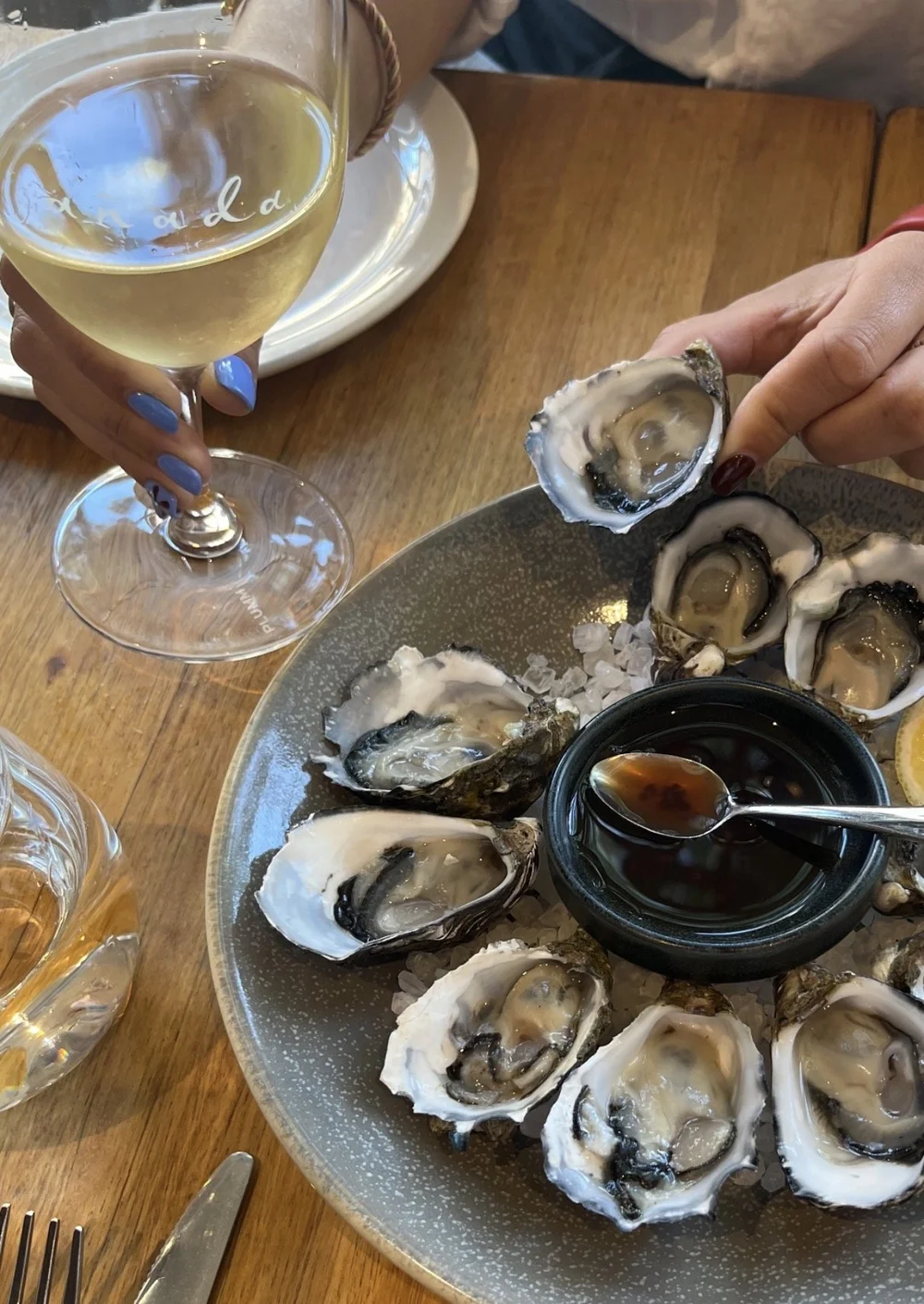 Fresh oysters with mignonette and a glass of white wine at Añada