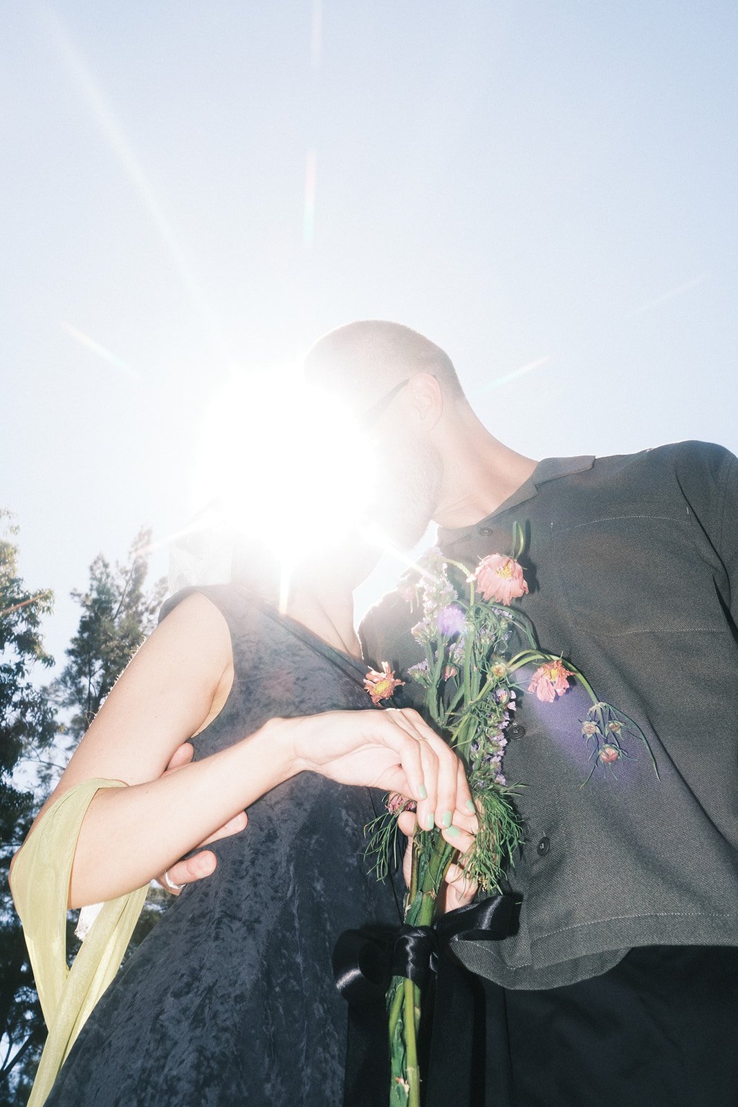A couple kissing at their engagement shoot in Melbourne.