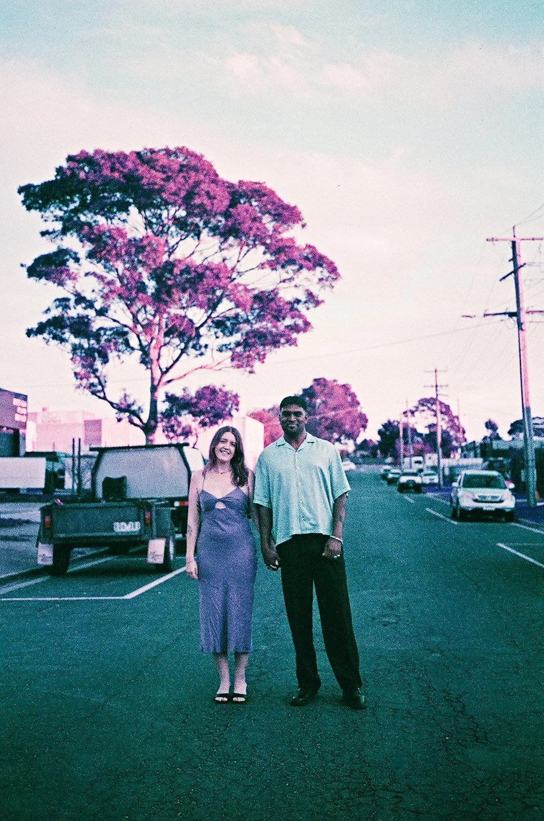 A bride and groom holding hands in the road in Mornington after their wedding at Commonfolk