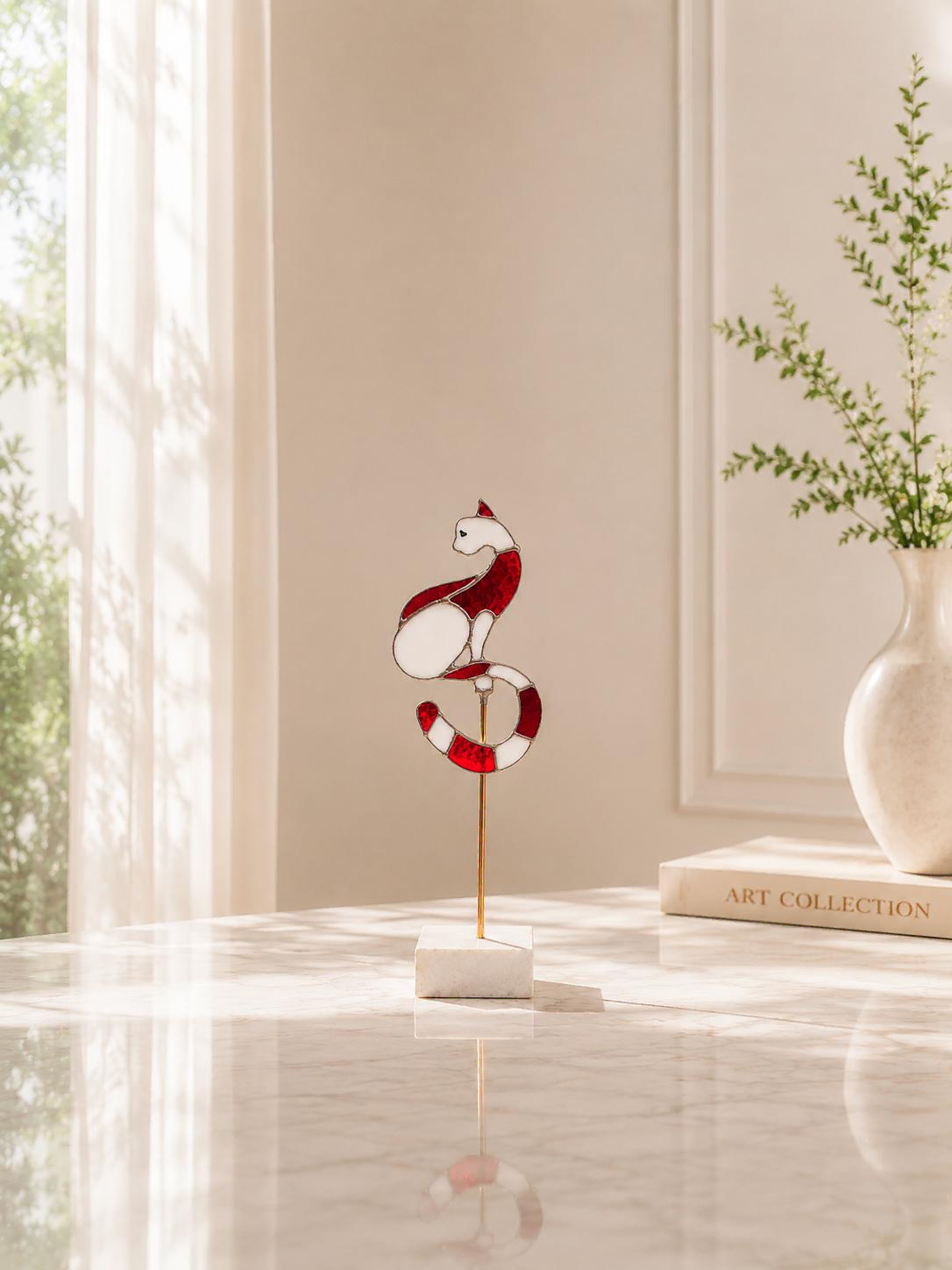 sol-red-white-stained-glass-cat-sculpture-marble-interior.webp